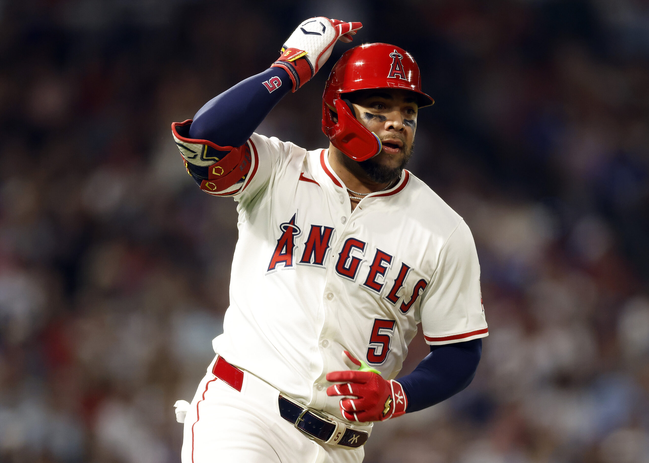 The Angels’ Yoán Moncada runs to first base after hitting...