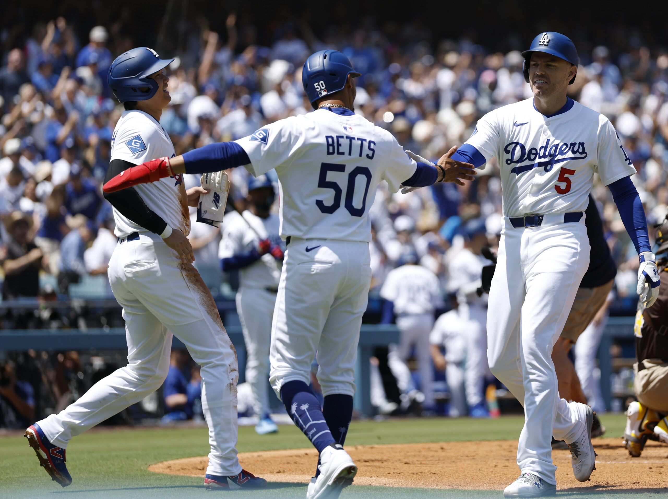 Freddie Freeman of the Dodgers celebrates his three-run home run...
