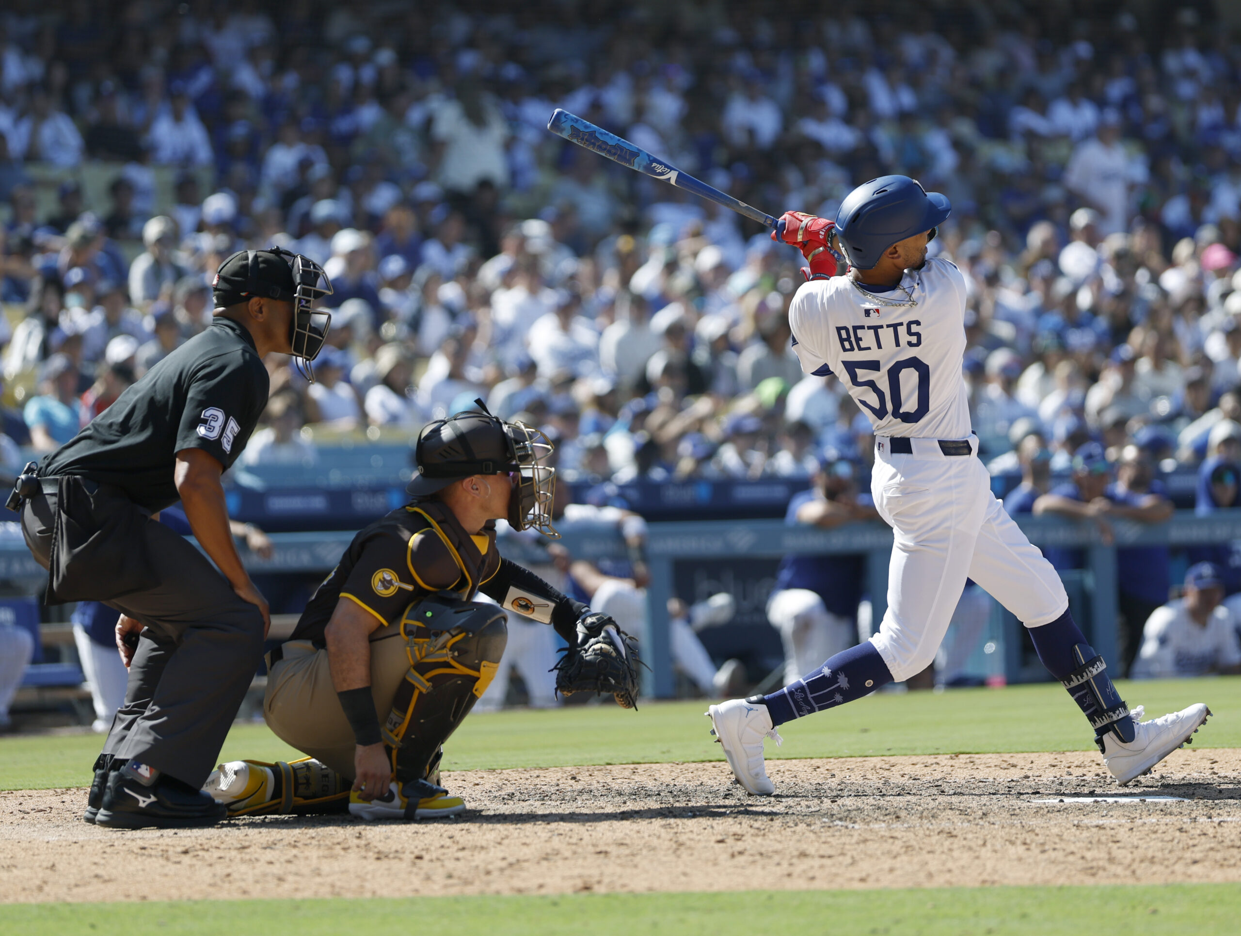 Mookie Betts of the Dodgers hits a solo home run...