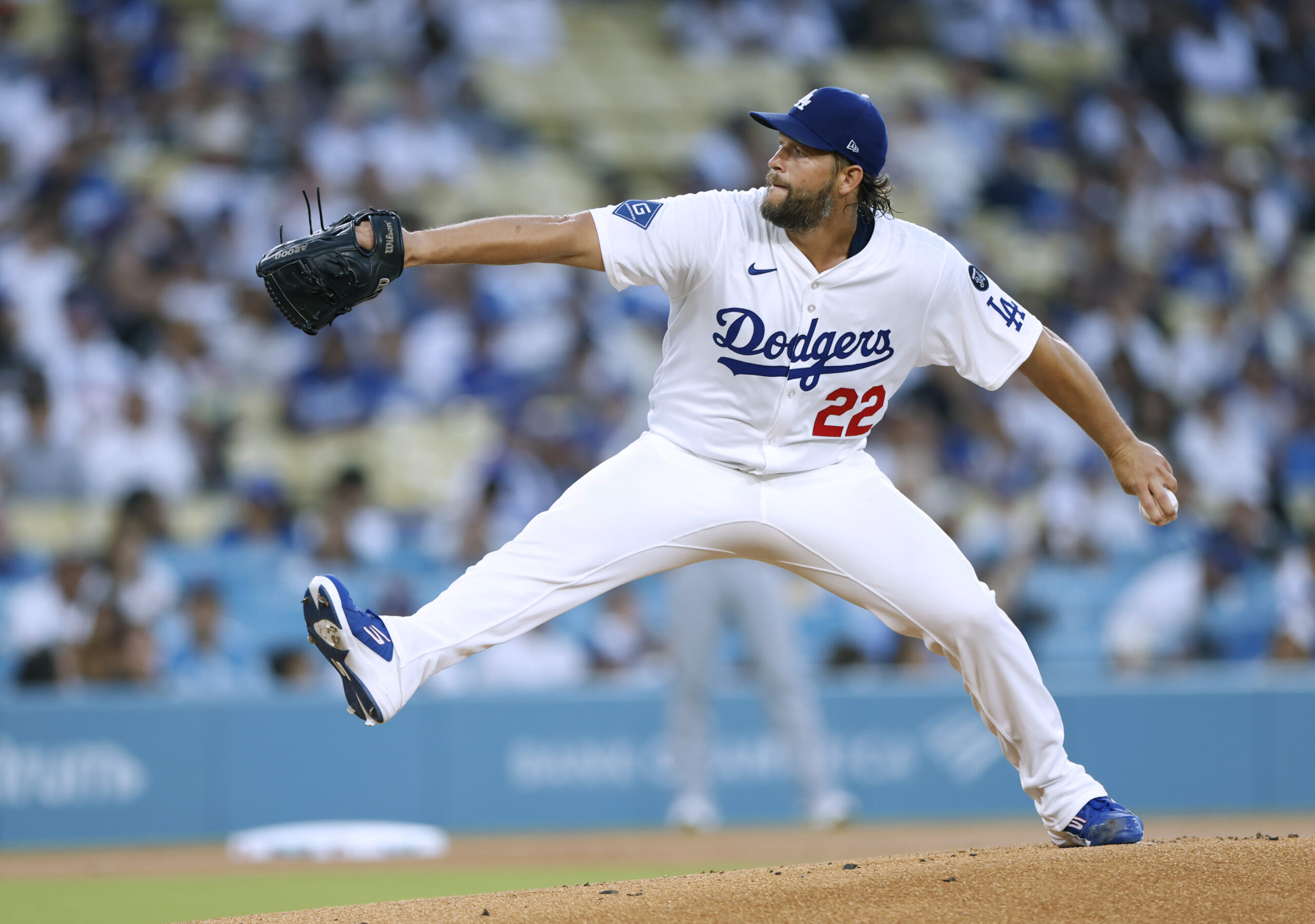 Dodgers starting pitcher Clayton Kershaw throws to the plate during...
