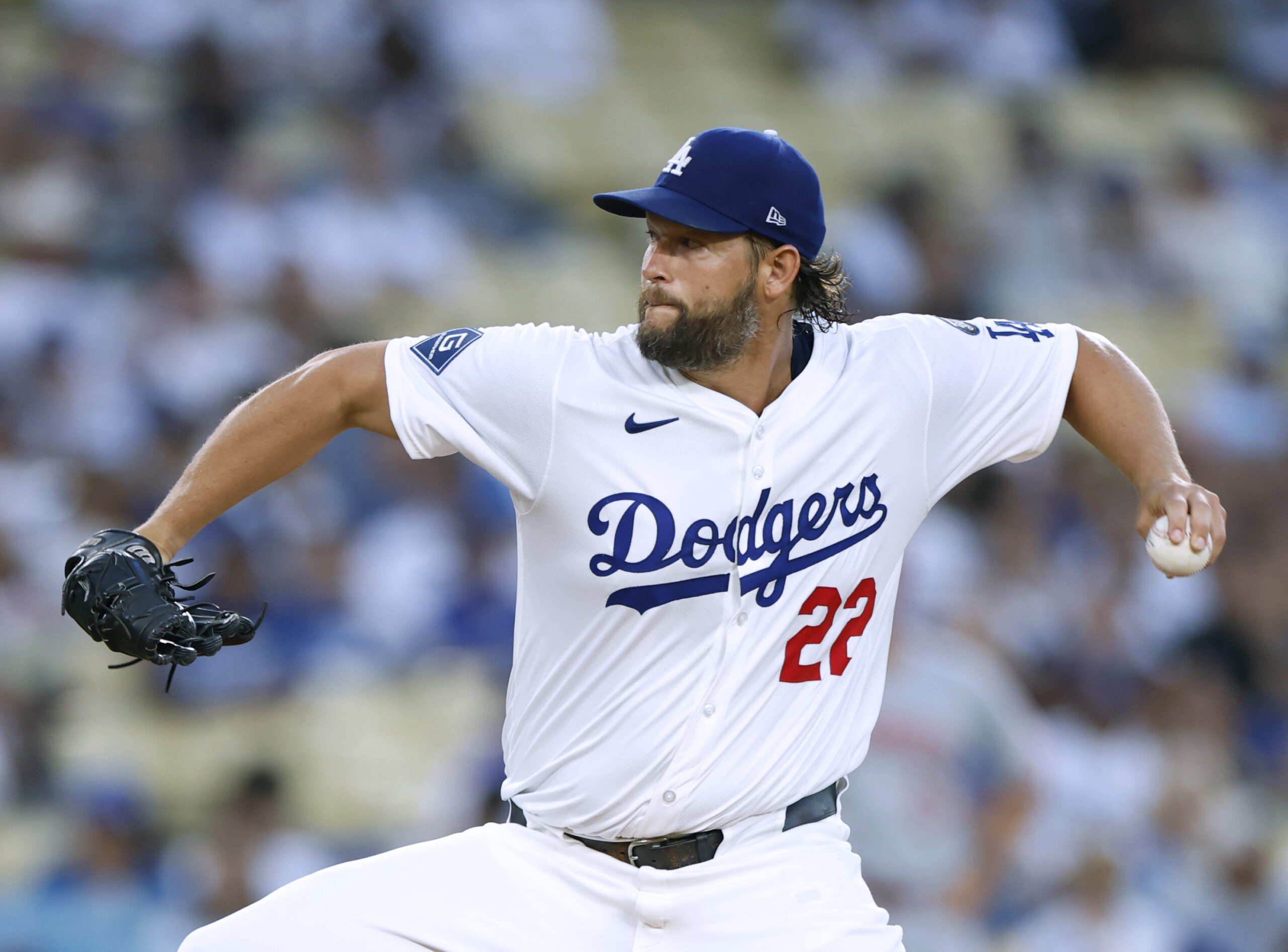 Dodgers starting pitcher Clayton Kershaw throws to the plate during...