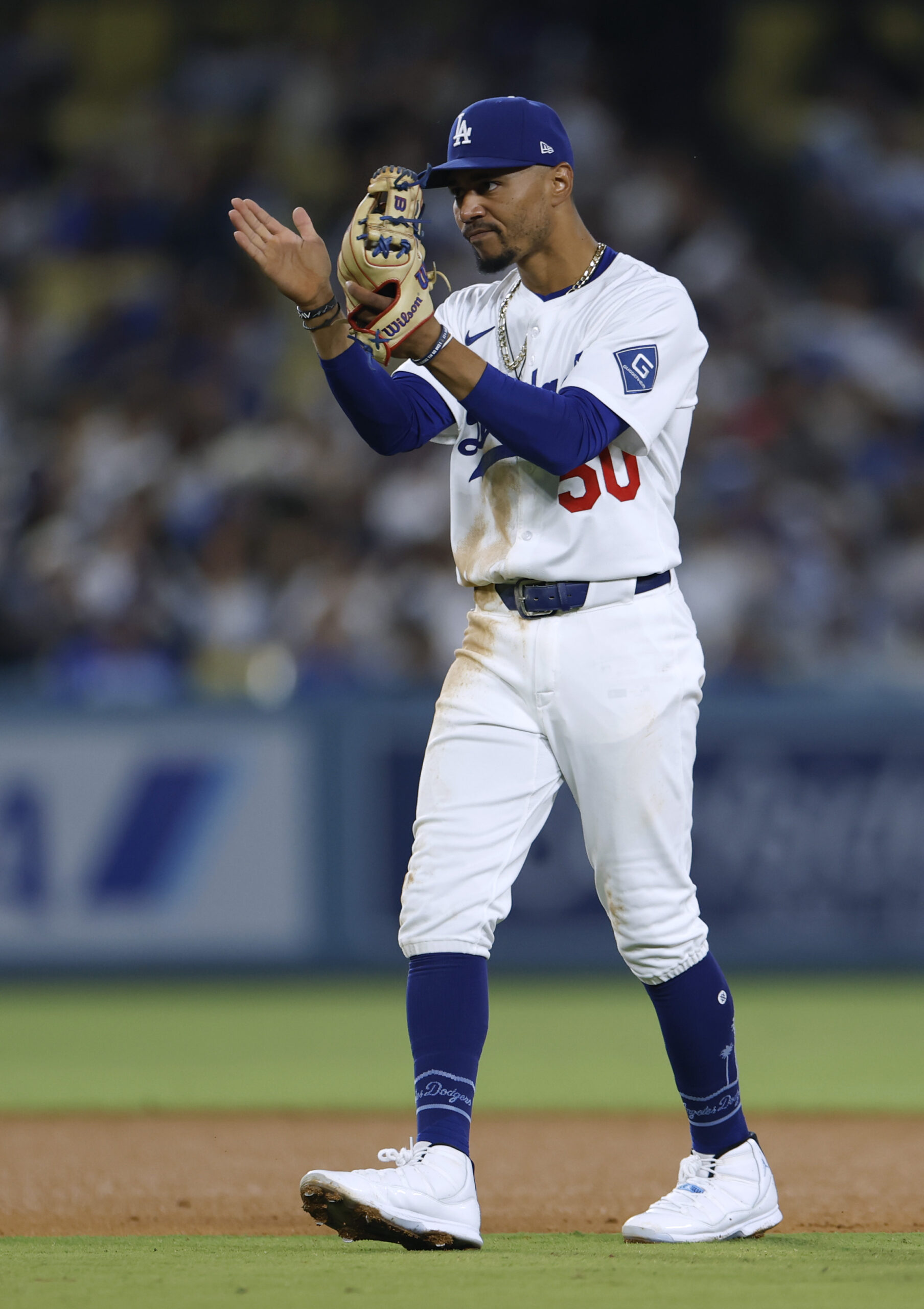 Dodgers shortstop Mookie Betts reacts after a double play during...