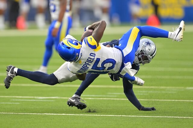 Aug 9, 2025; Inglewood, California, USA; Dallas Cowboys safety Mike Smith Jr. (39) stops Los Angeles Rams wide receiver Konata Mumpfield (15) after a complete pass during the second half at SoFi Stadium. Mandatory Credit: Jayne Kamin-Oncea-Imagn Images Konata Mumpfield, Rams