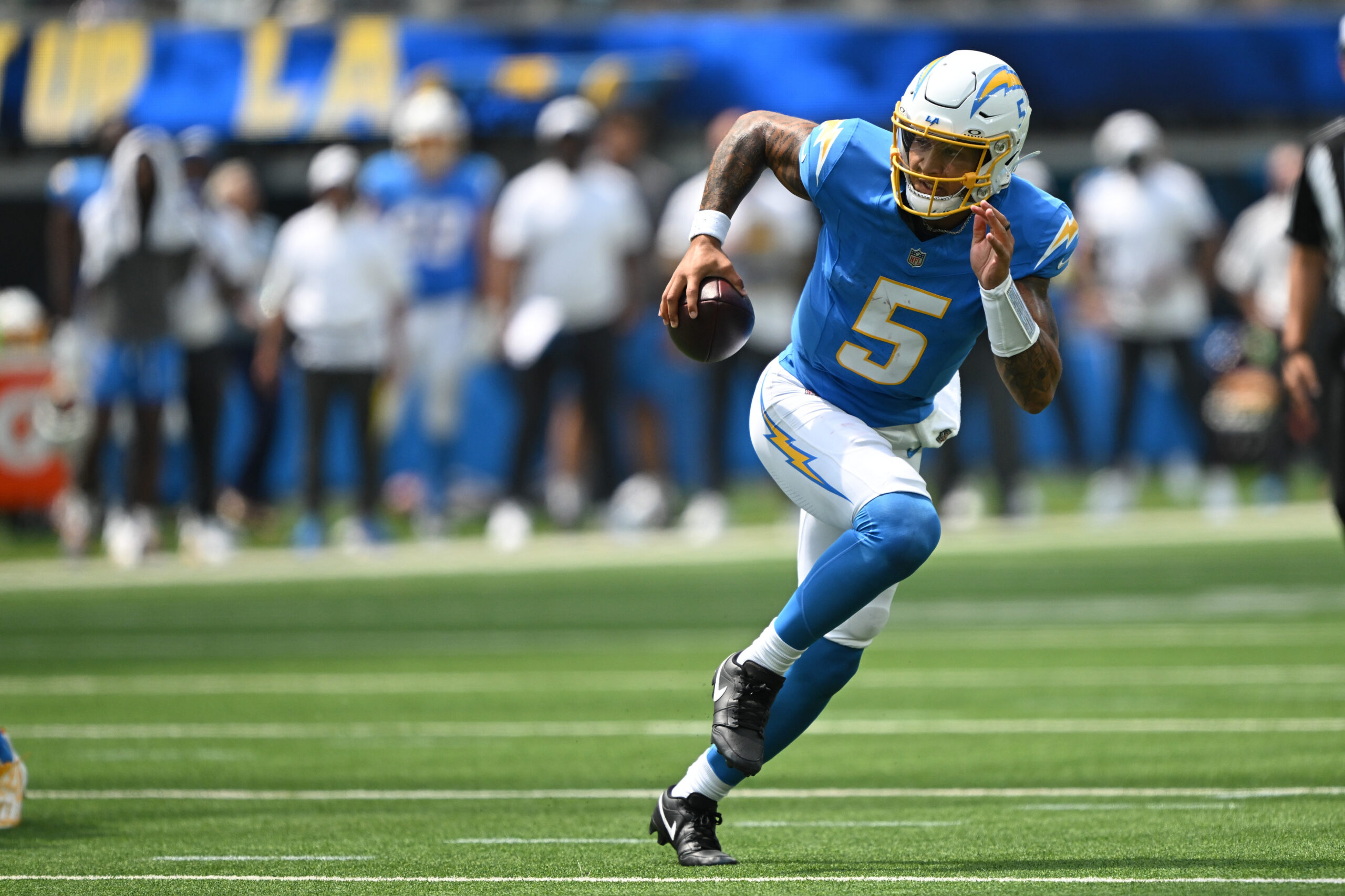 The Chargers Trey Lance, #5, gets free for a long...