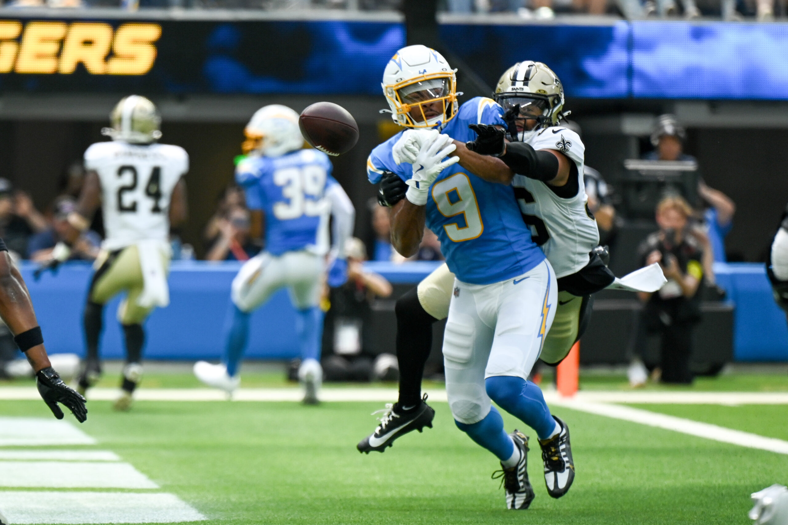 An end zone pass intended for Chargers Tre Harris, #9,...