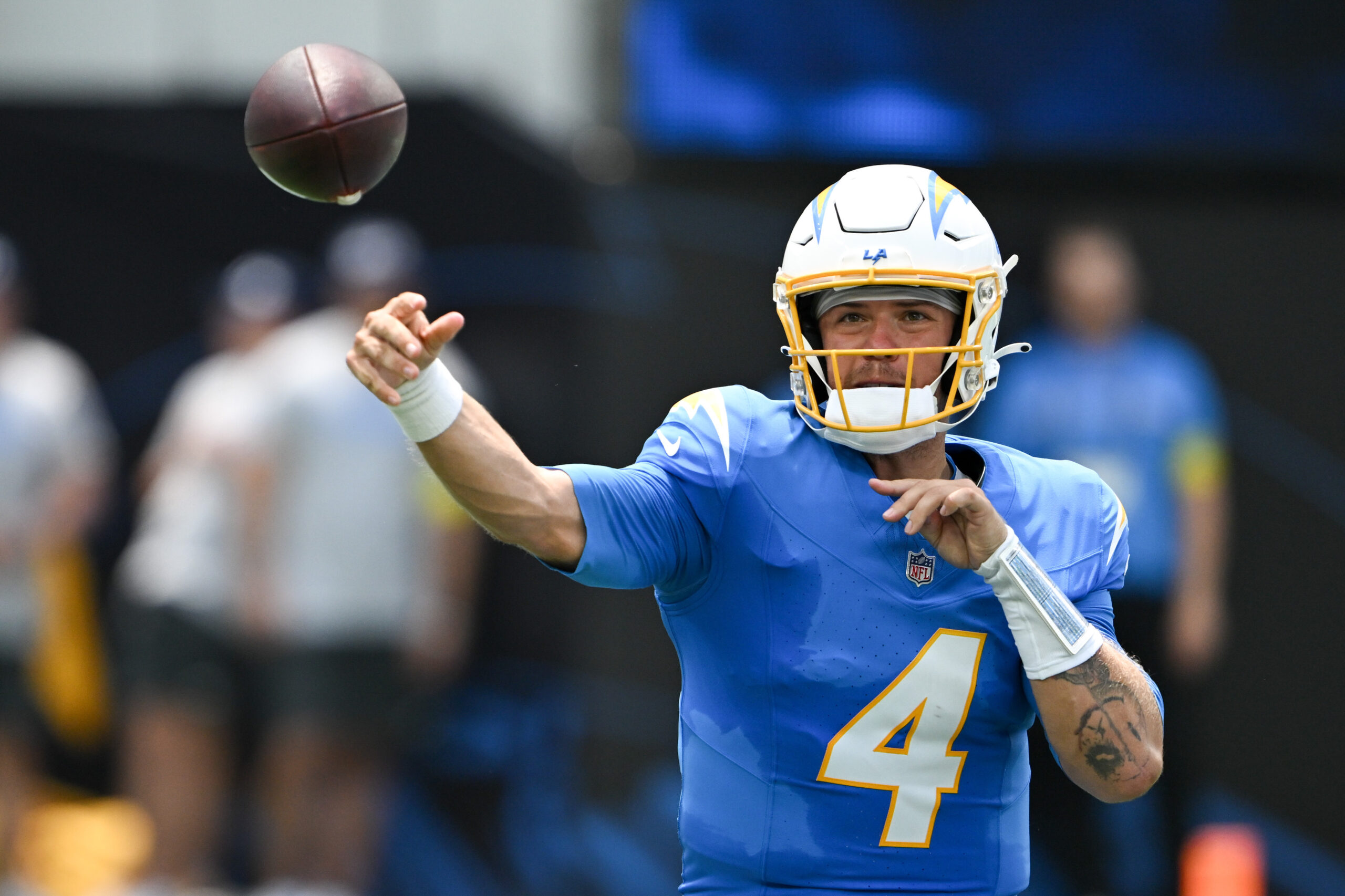 The Chargers Taylor Heinicke, #4, passes during first quarter action...