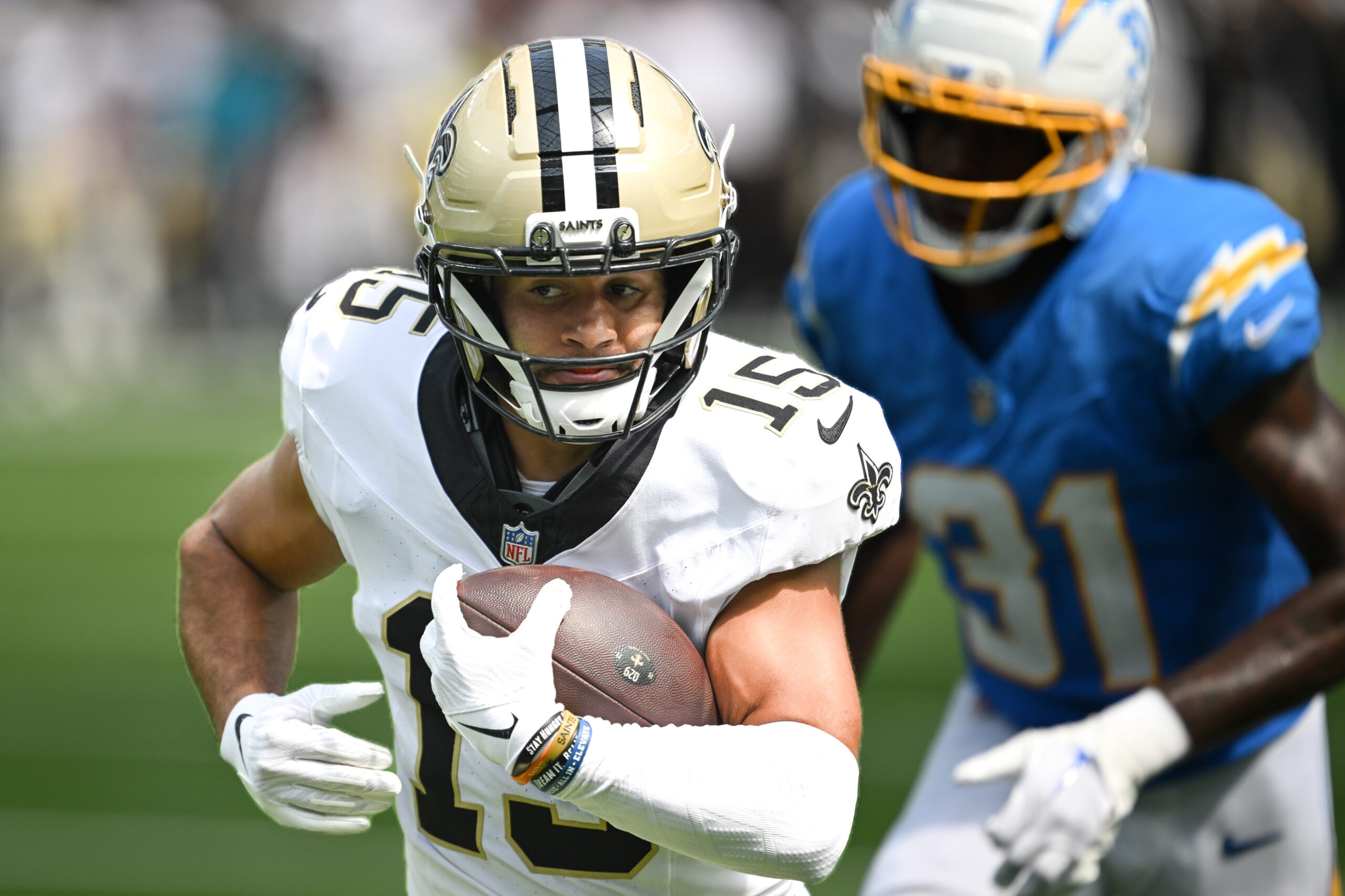 The Saints Mason Tipton, #15, outruns Chargers Jordan Howden, 31,...