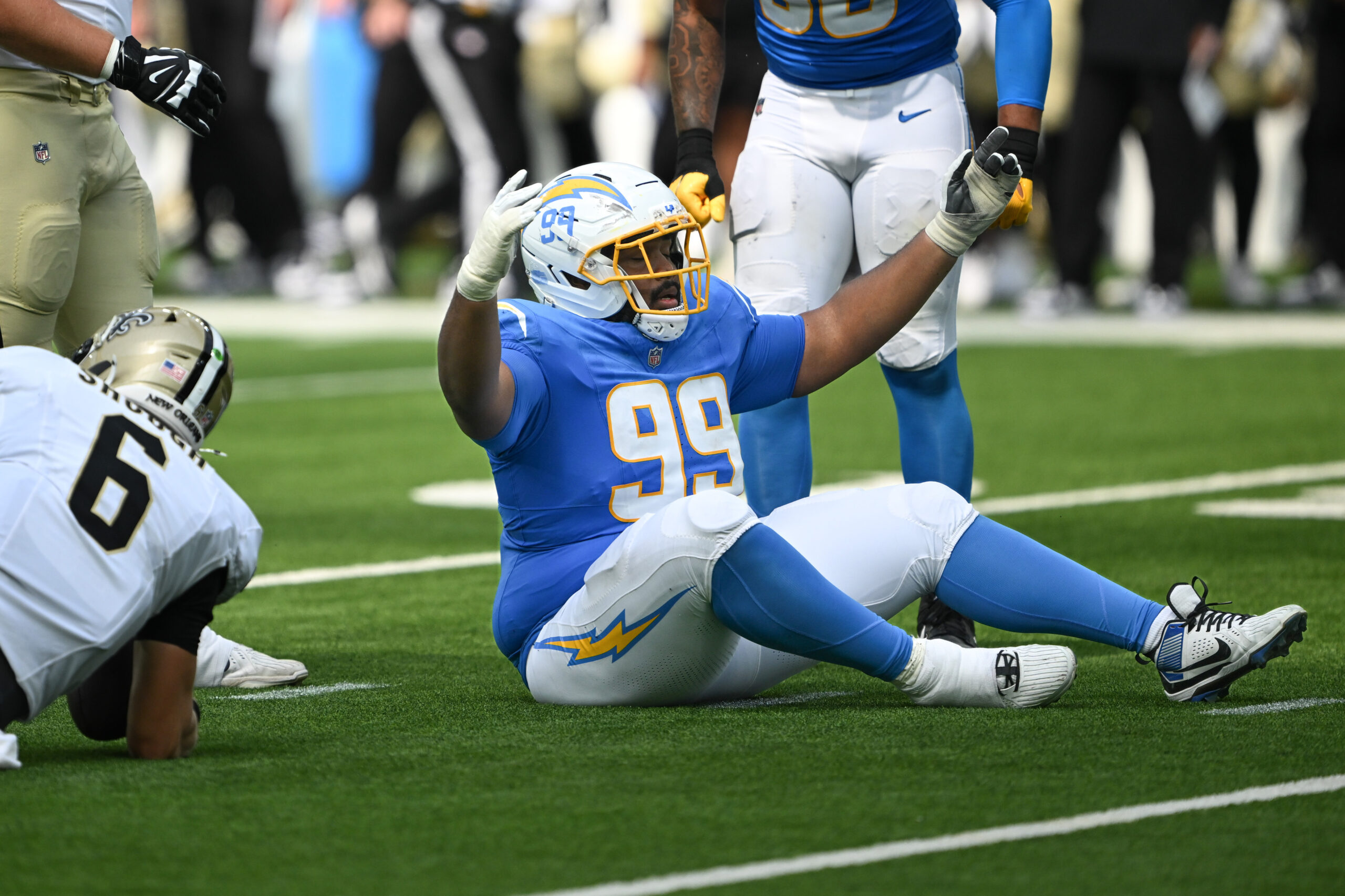 The Chargers TeRah Edwards, #94, celebrates a sack of Saints...