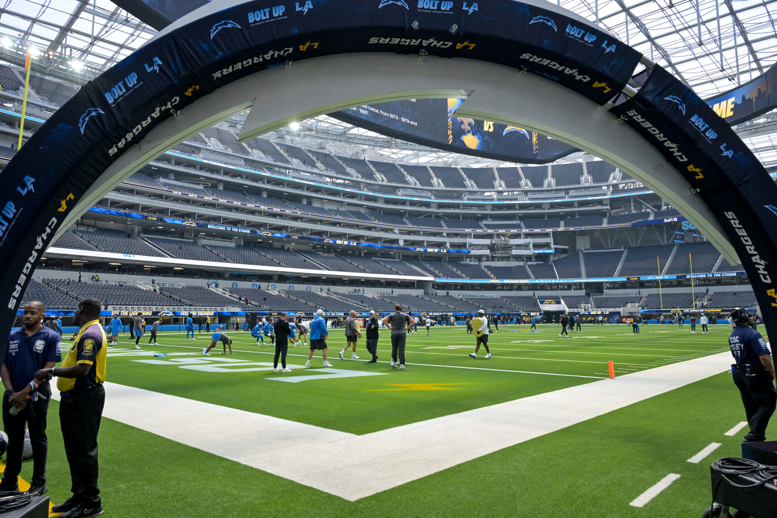 The Chargers warm up at SoFi Stadium for their pre-season...