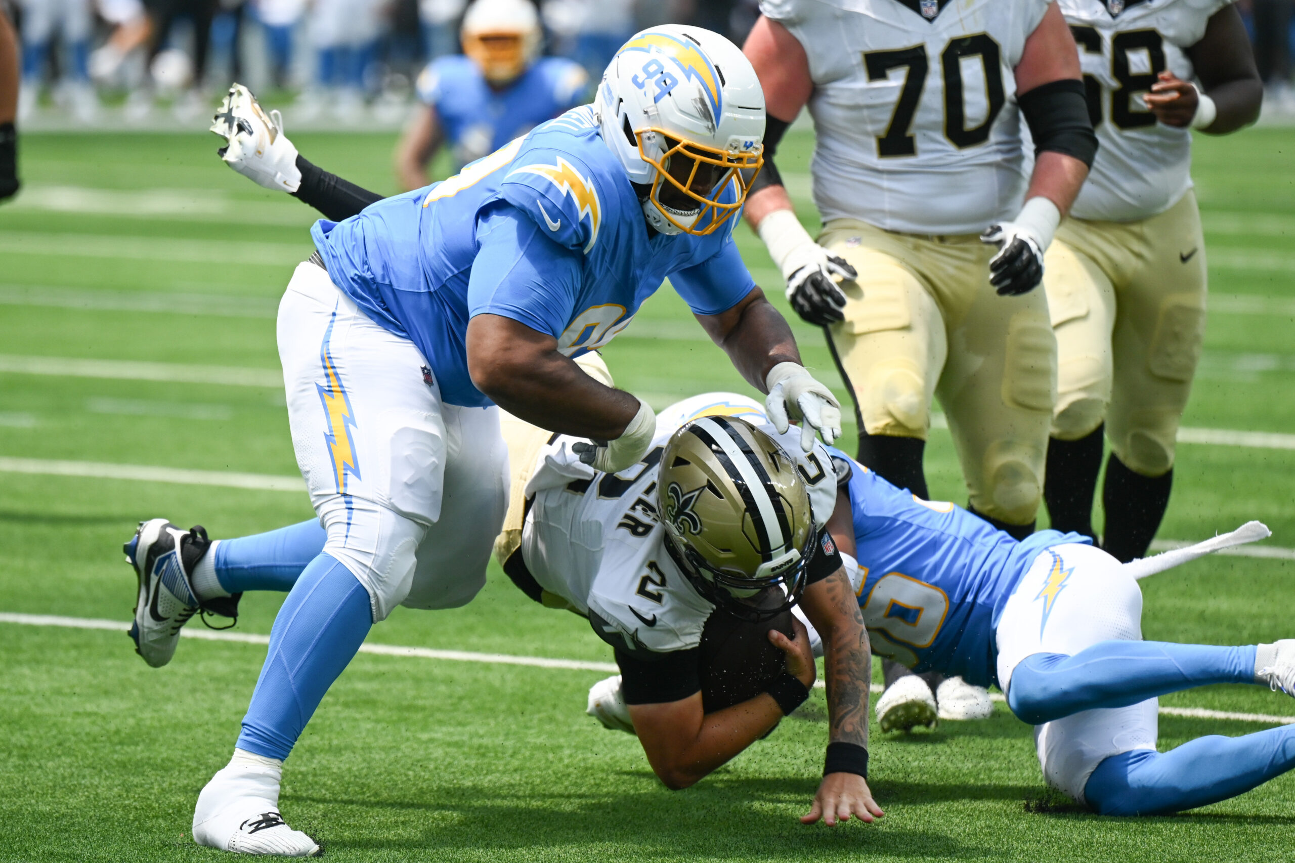 The Chargers Jamaree Caldwell, #99, and Rico Payton, #36, sack...