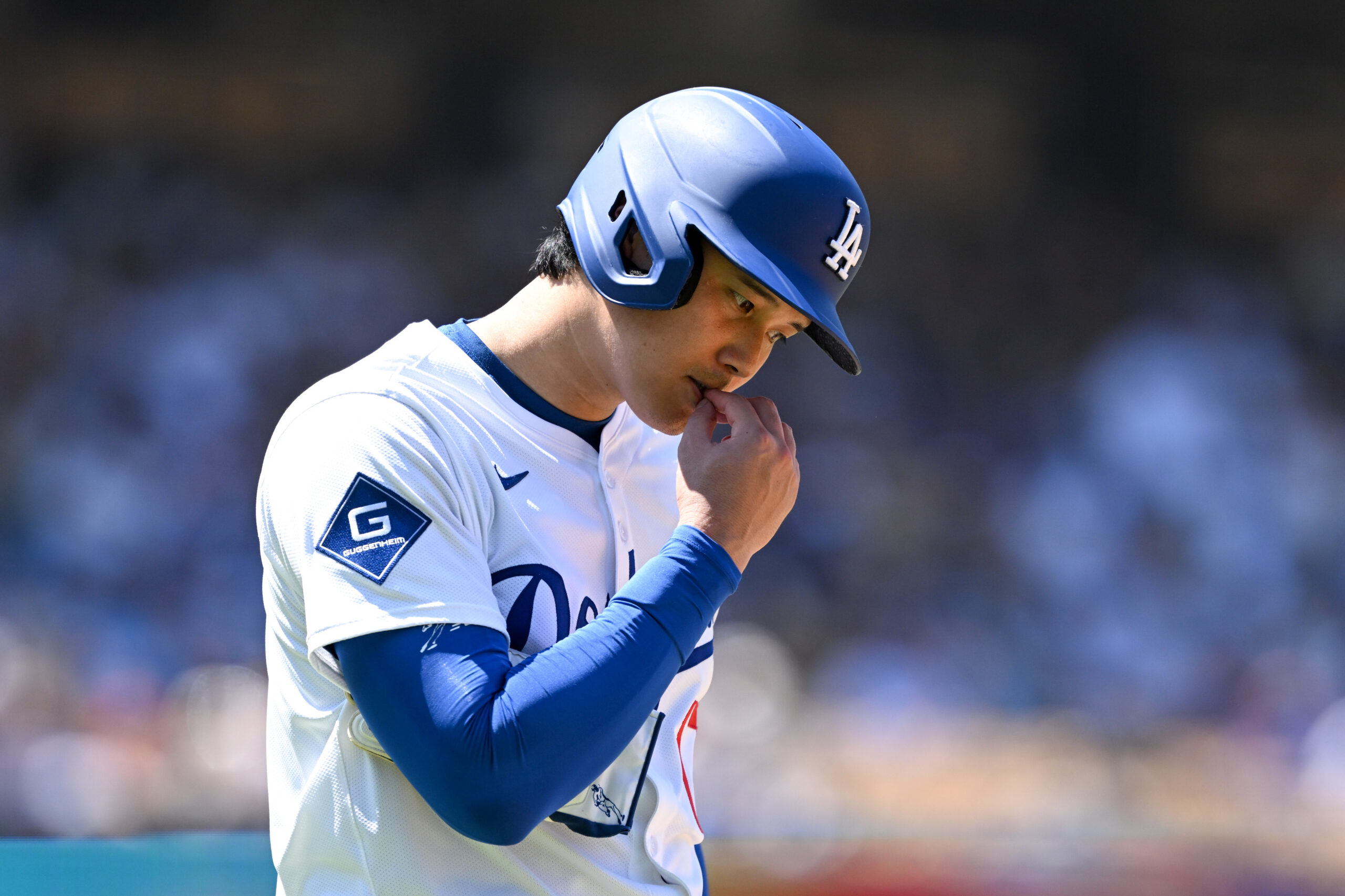 Dodgers Shohei Ohtani, #17, checks his nails during 3rd inning...
