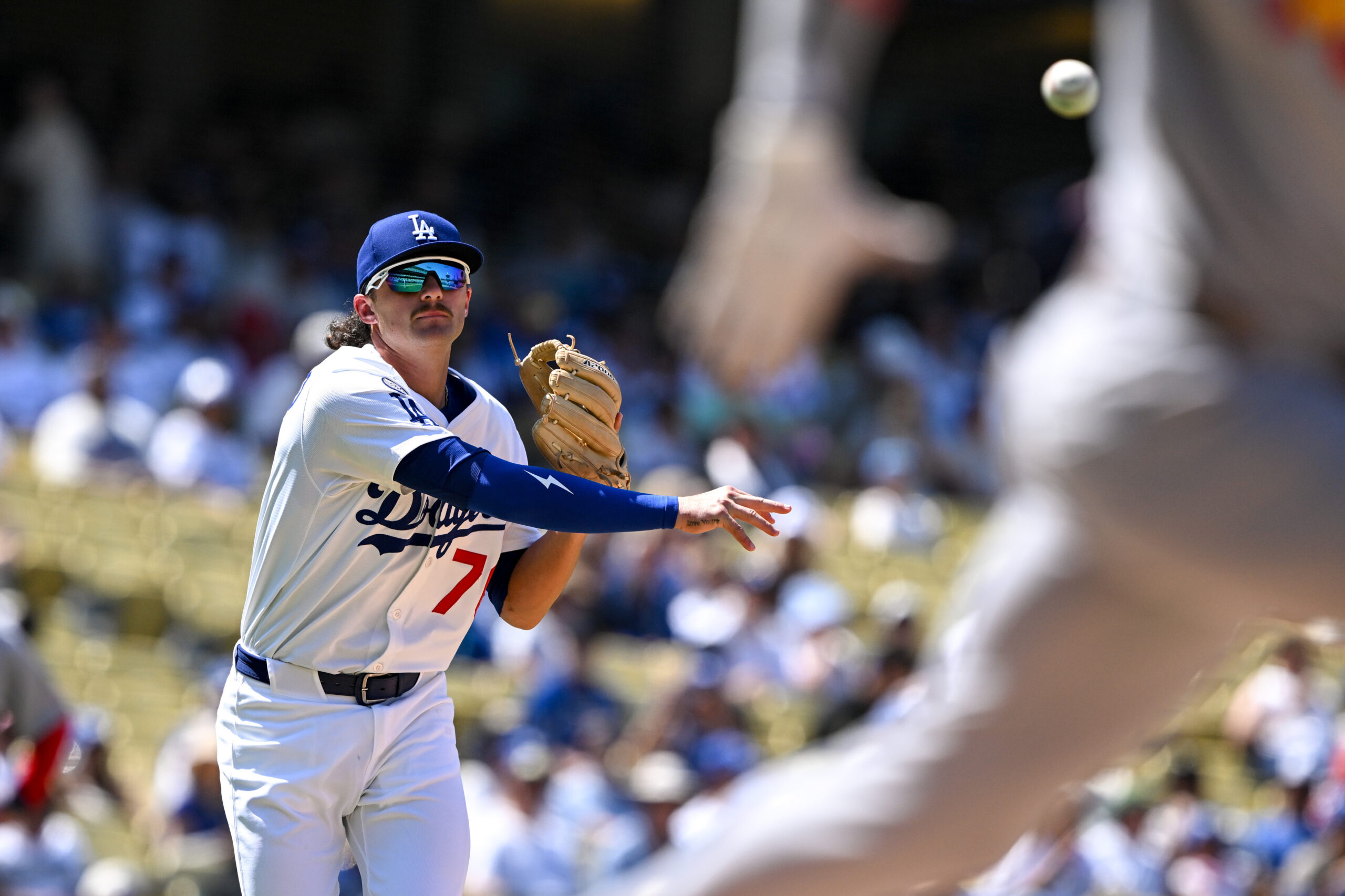 Dodgers Alex Freeland, #76, throws out Cardinals Pedro Pages during...