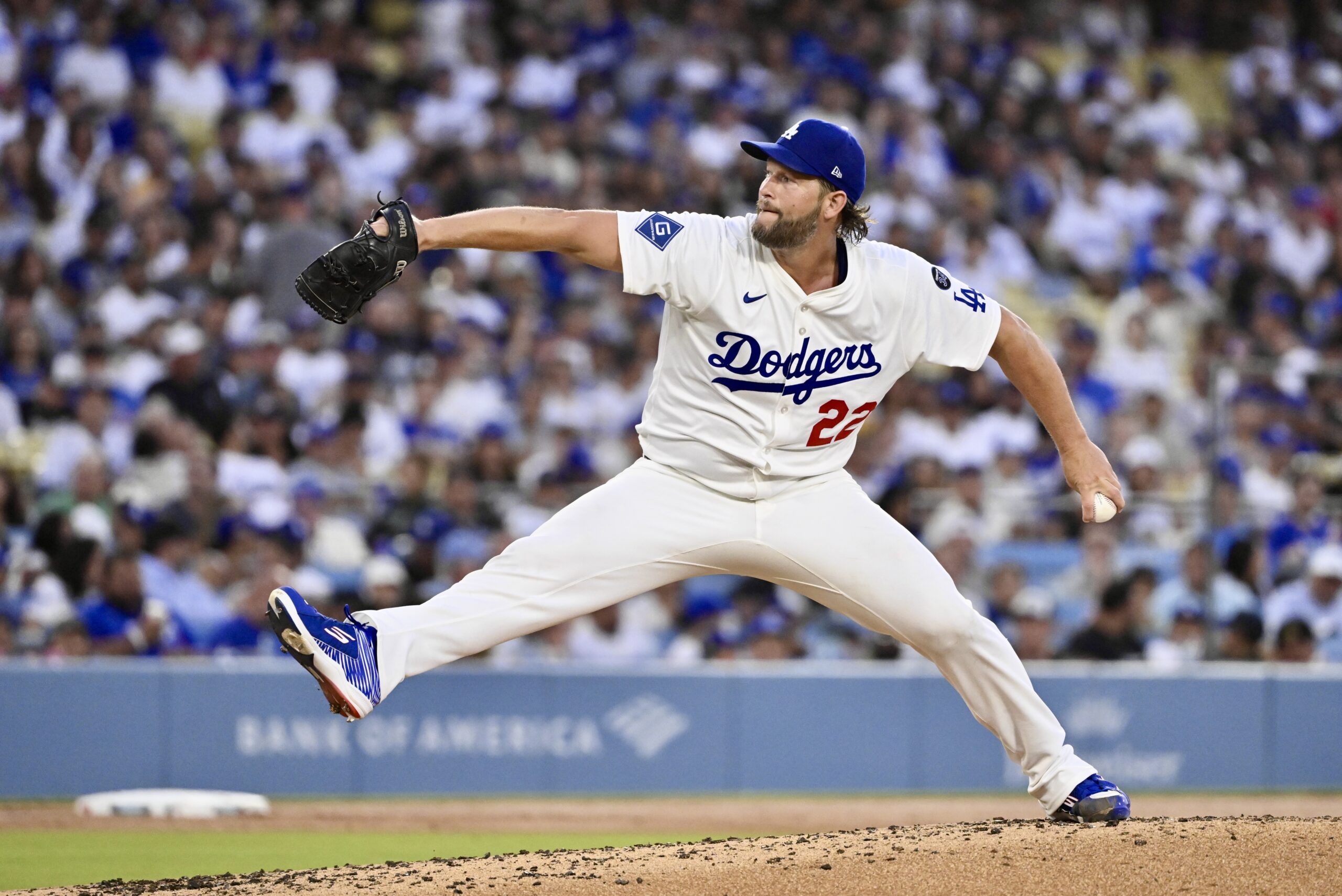 Dodgers starting pitcher Clayton Kershaw throws to the plate during...