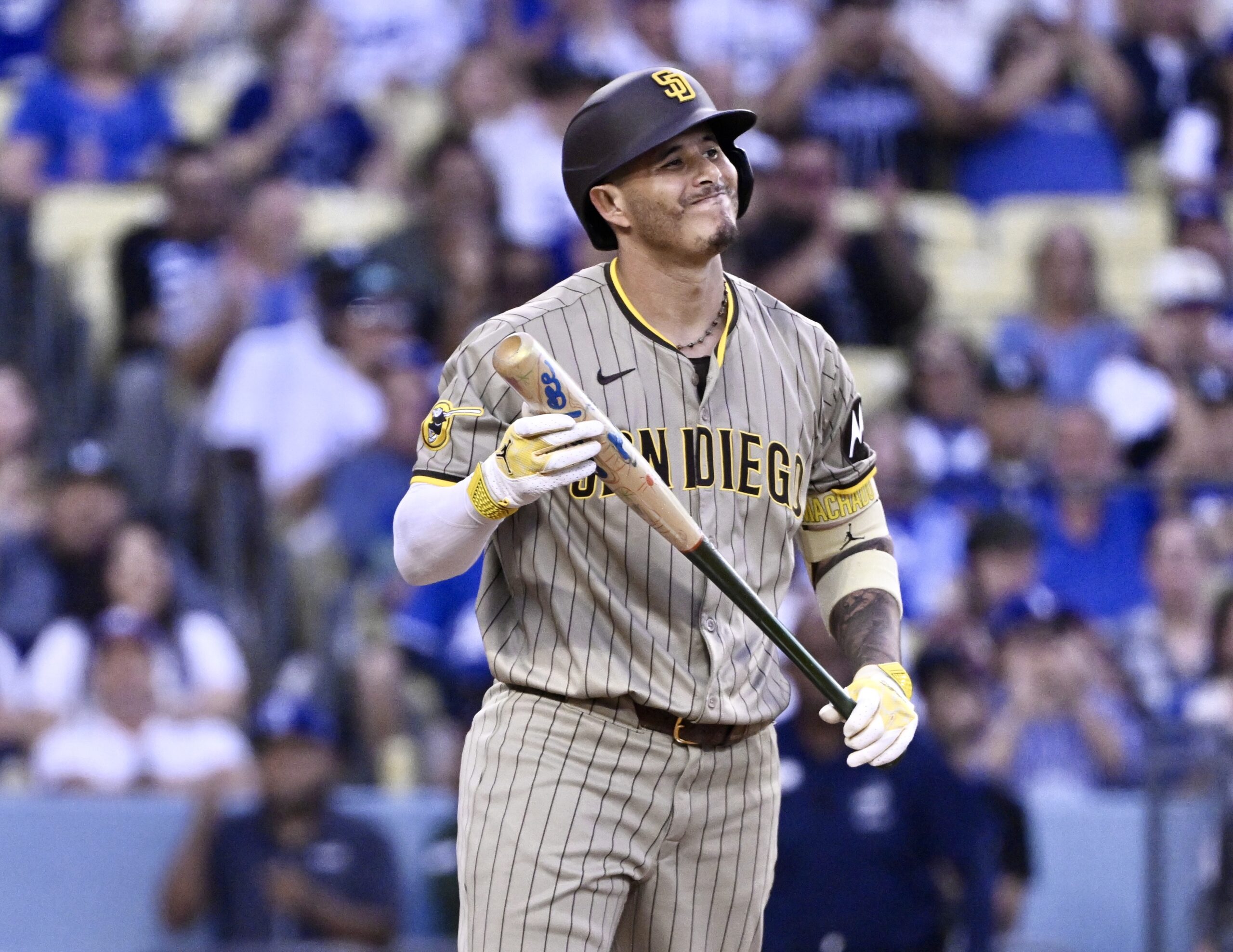 San Diego Padres star Manny Machado reacts after striking out...