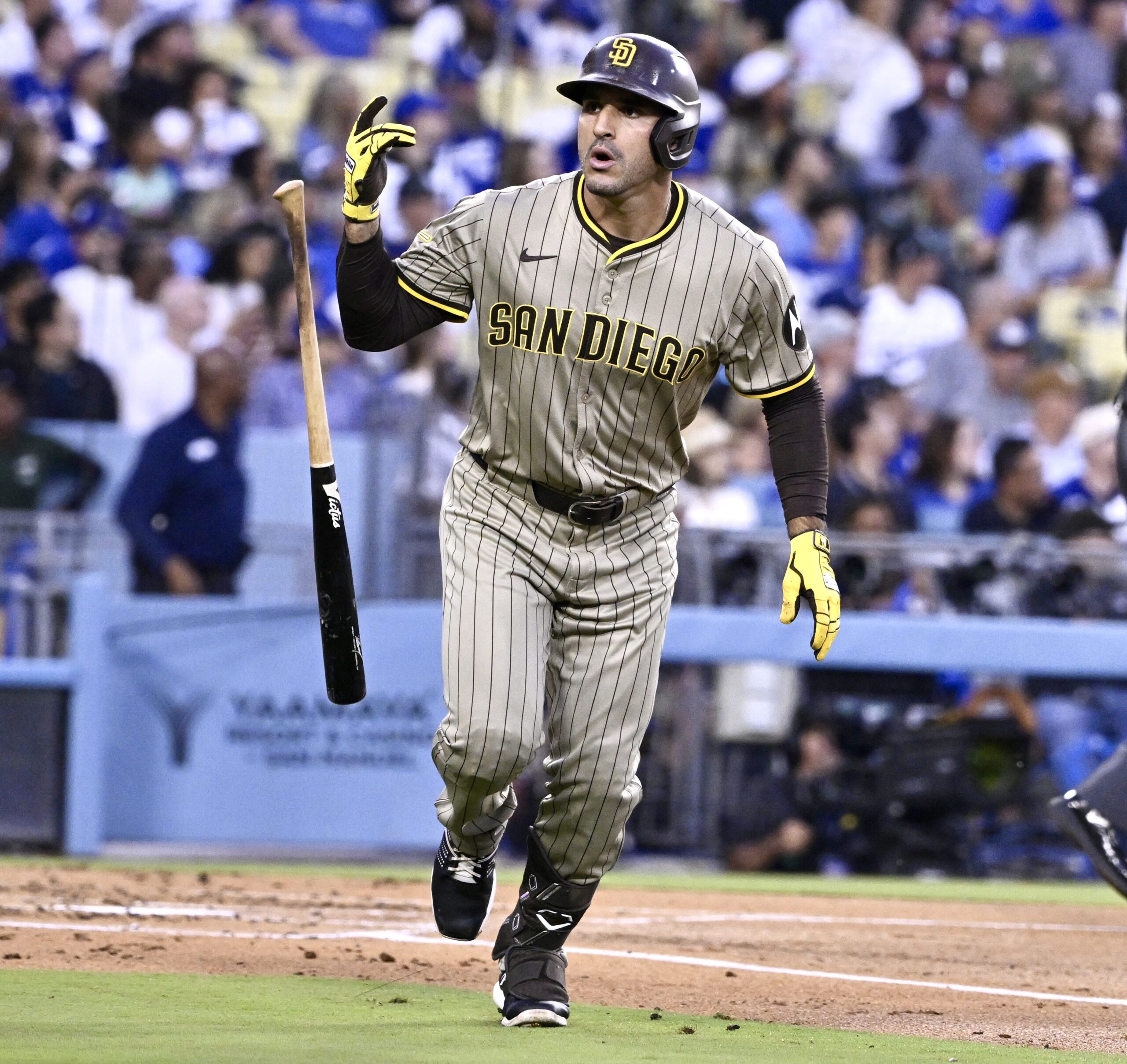 The San Diego Padres’ Ramon Laureano flips his bat in...