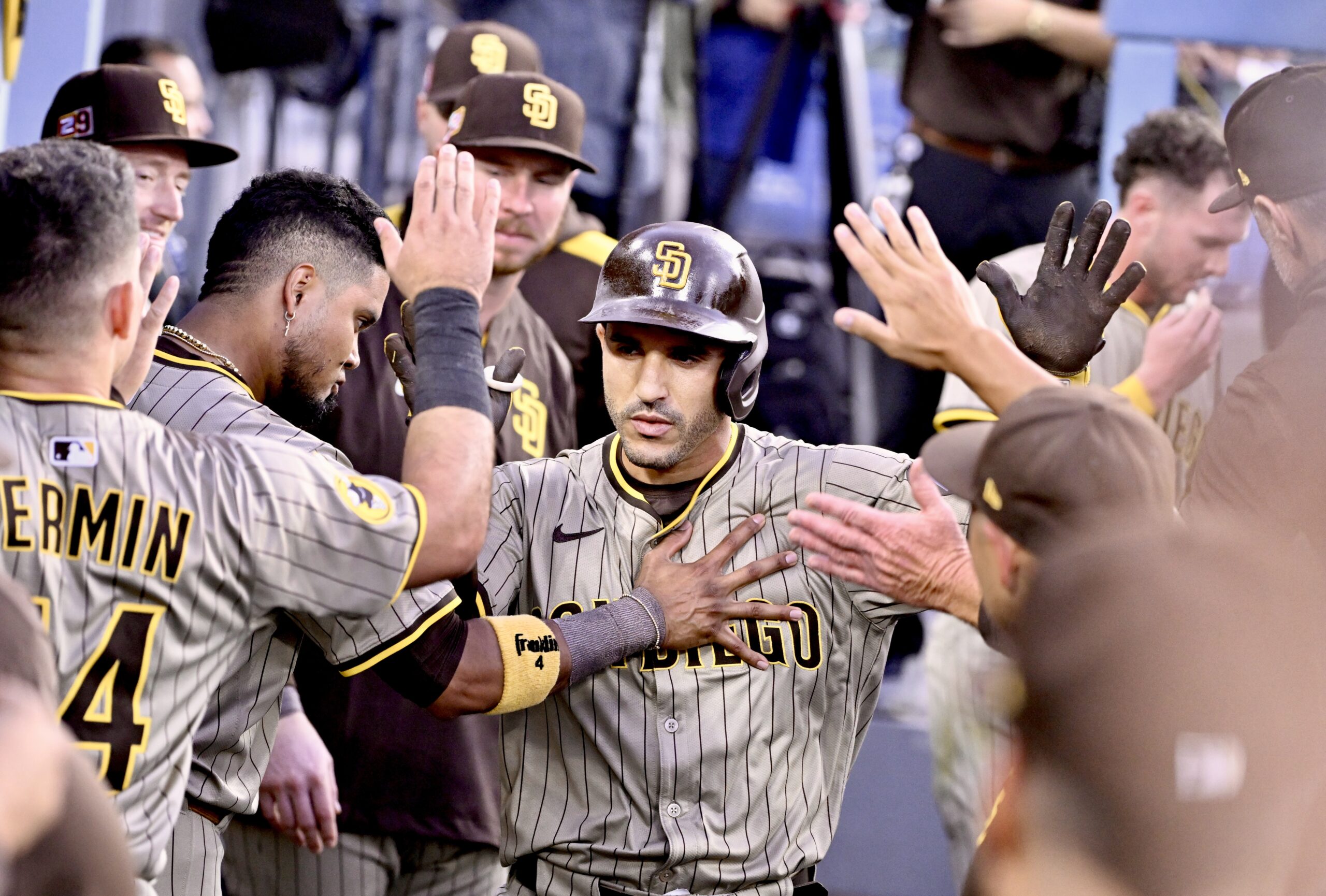 The San Diego Padres’ Ramon Laureano celebrates with teammates in...