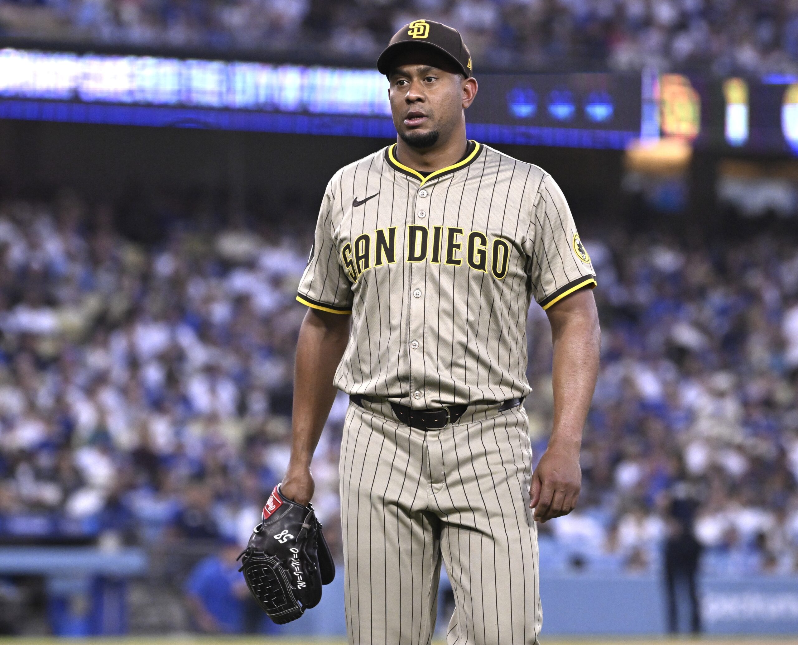 San Diego Padres opening pitcher Wandy Peralta walks to the...