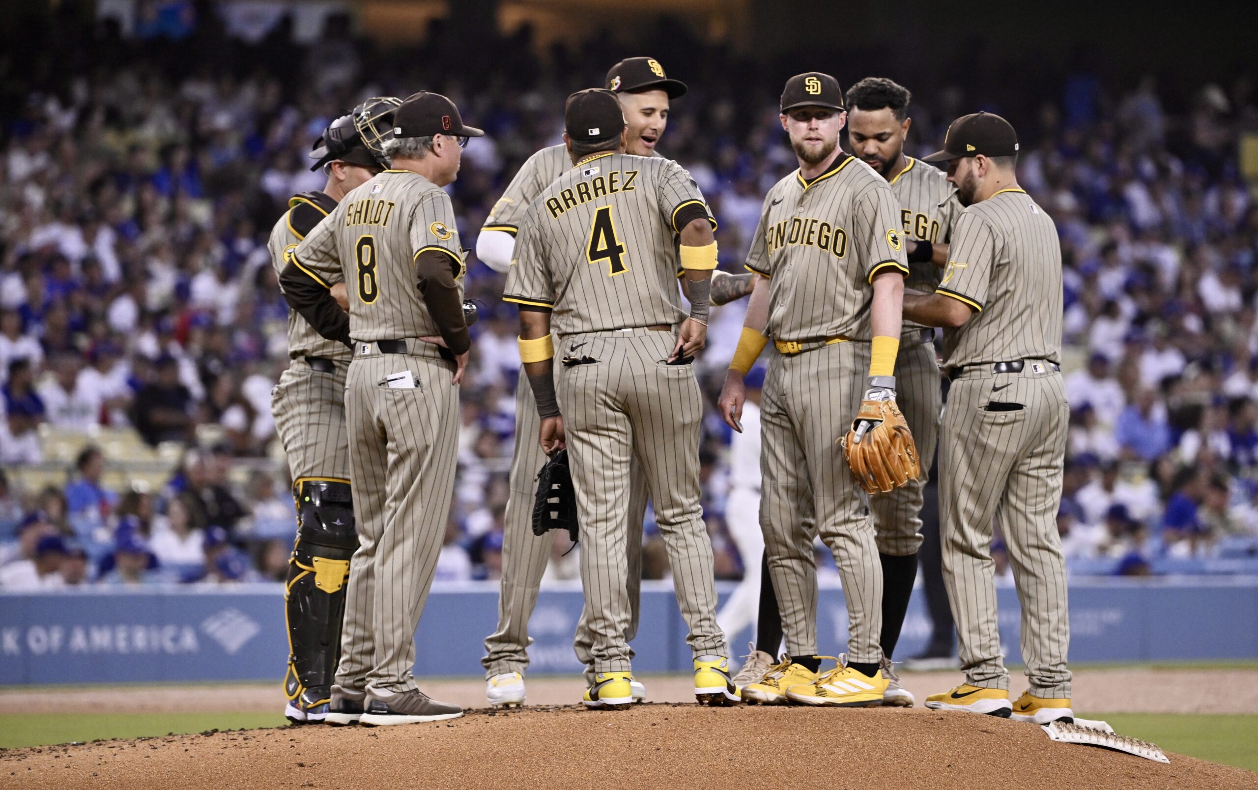 San Diego Padres players gather on the mound during a...