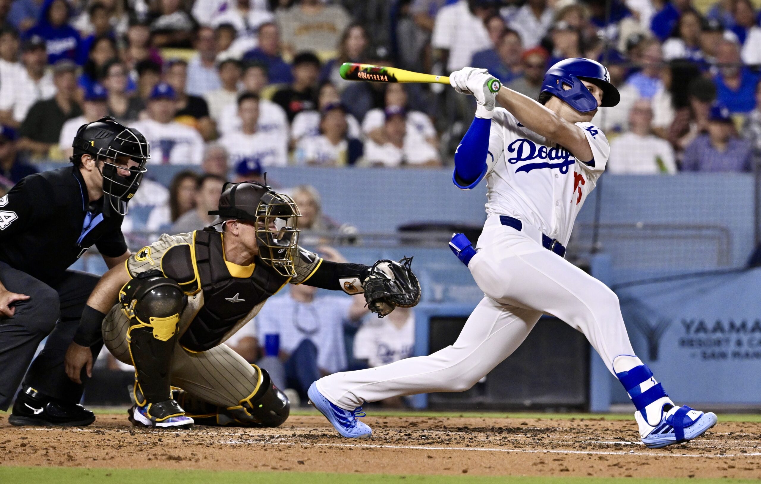 The Dodgers’ Alex Freeland hits a single during the third...