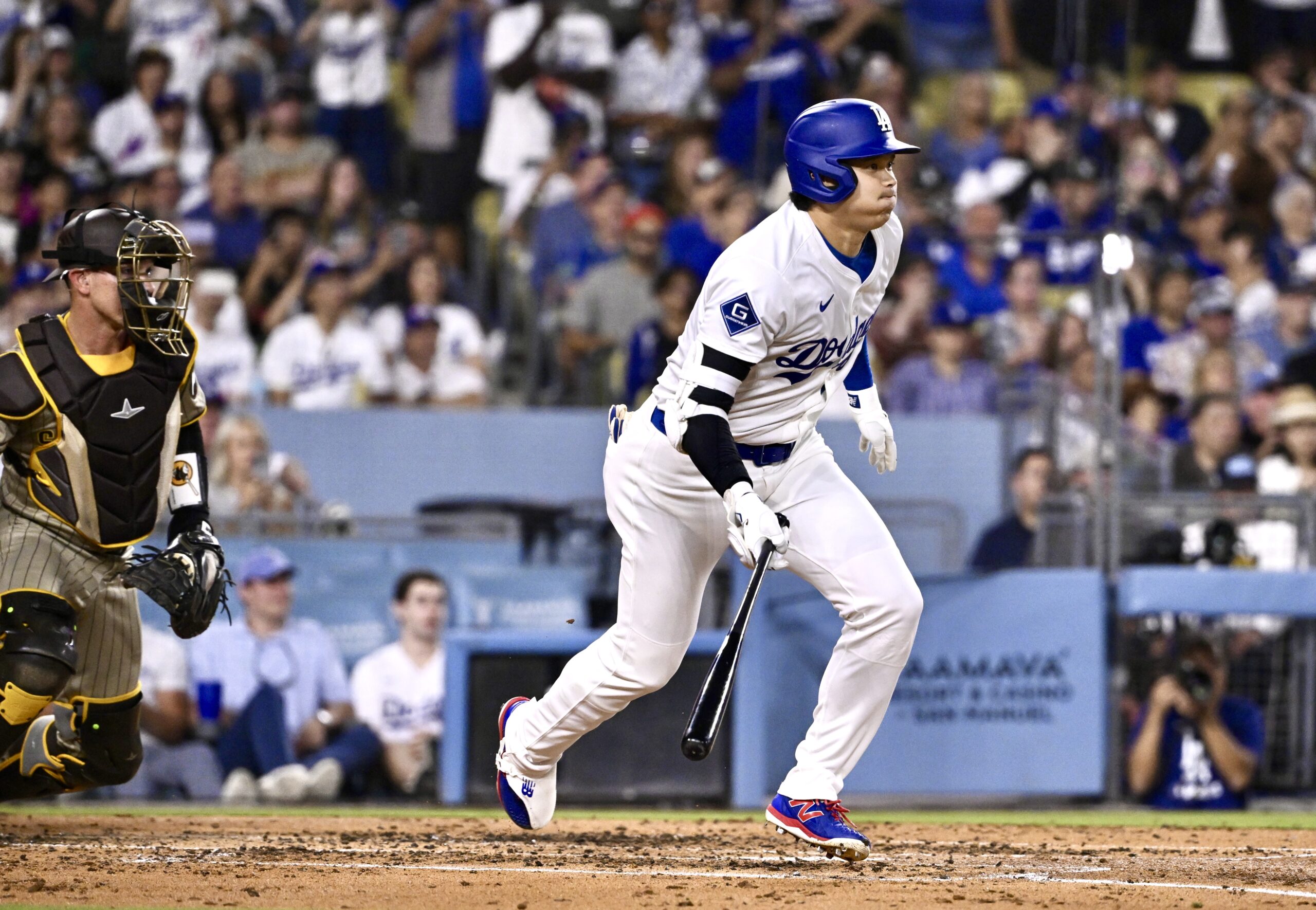 Dodgers star Shohei Ohtani hits into a fielders’ choice as...