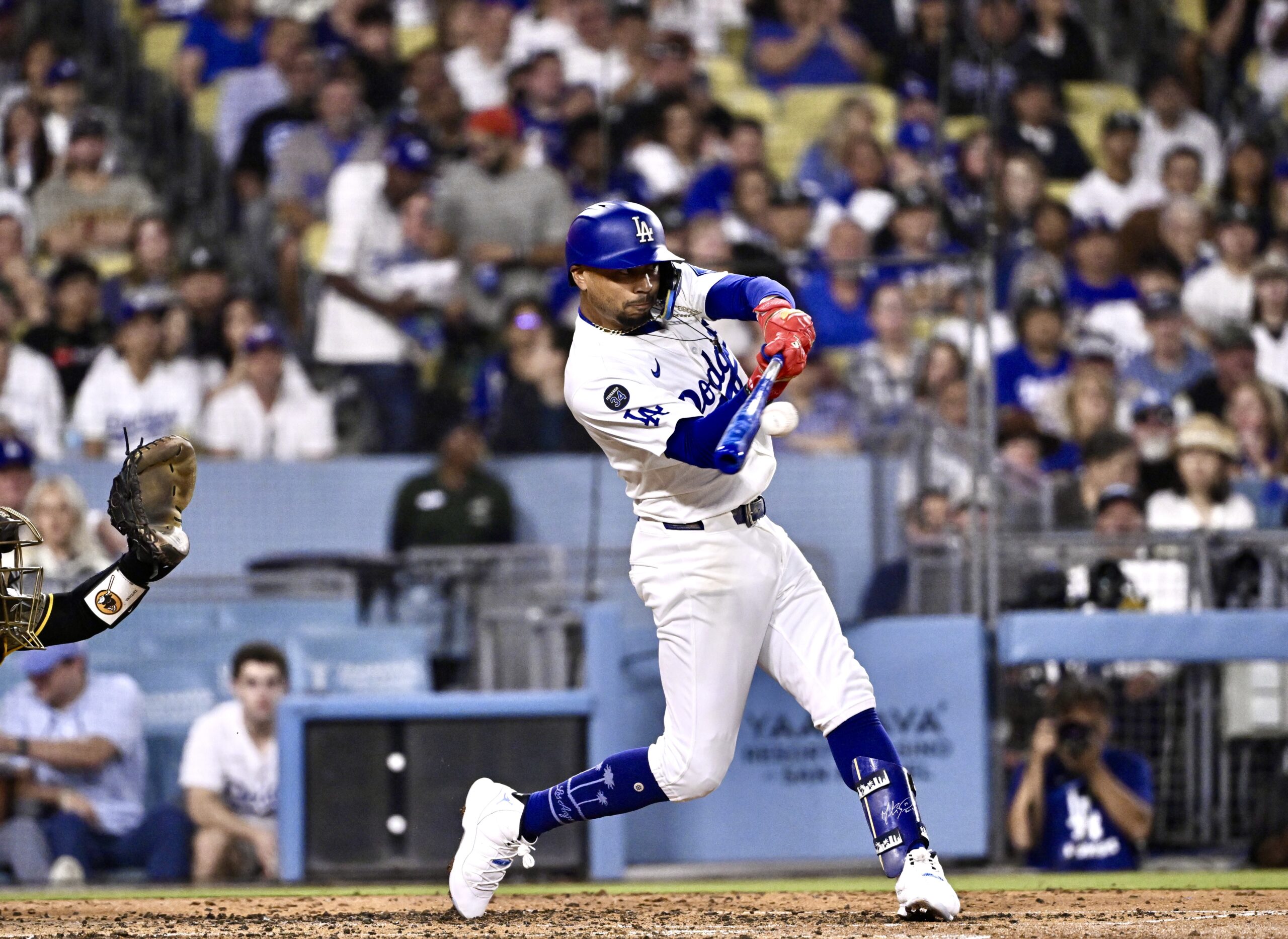 The Dodgers’ Mookie Betts hits a sacrifice fly to score...