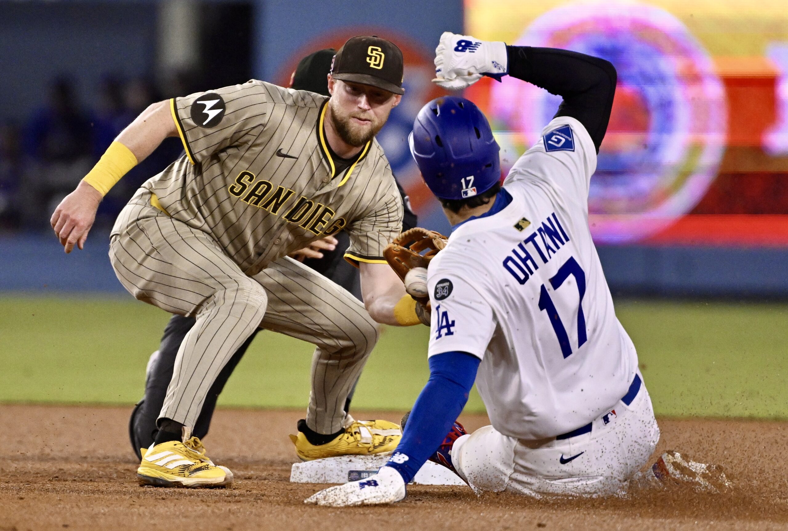San Diego Padres second baseman Jake Cronenworth tags out Dodgers...