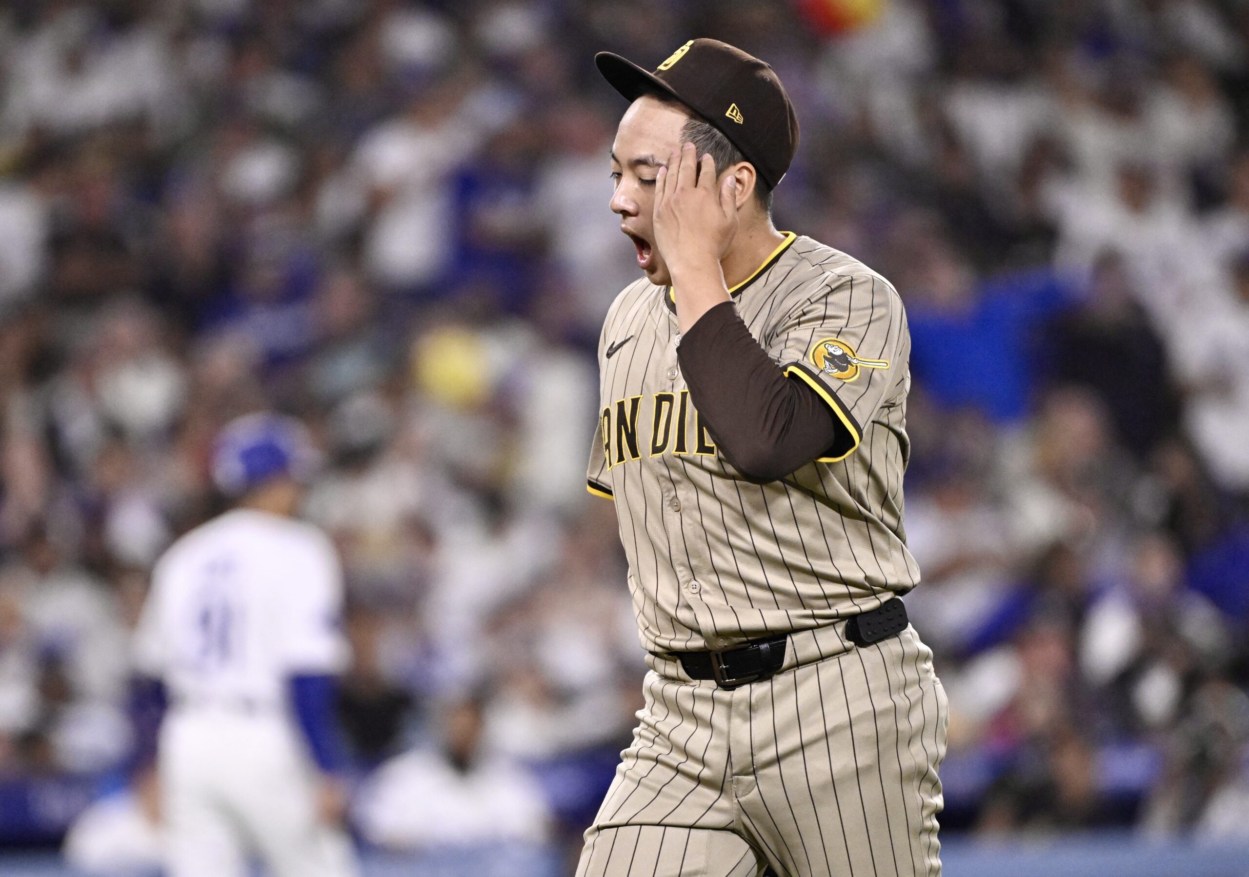 San Diego Padres relief pitcher Yuki Matsui reacts after getting...
