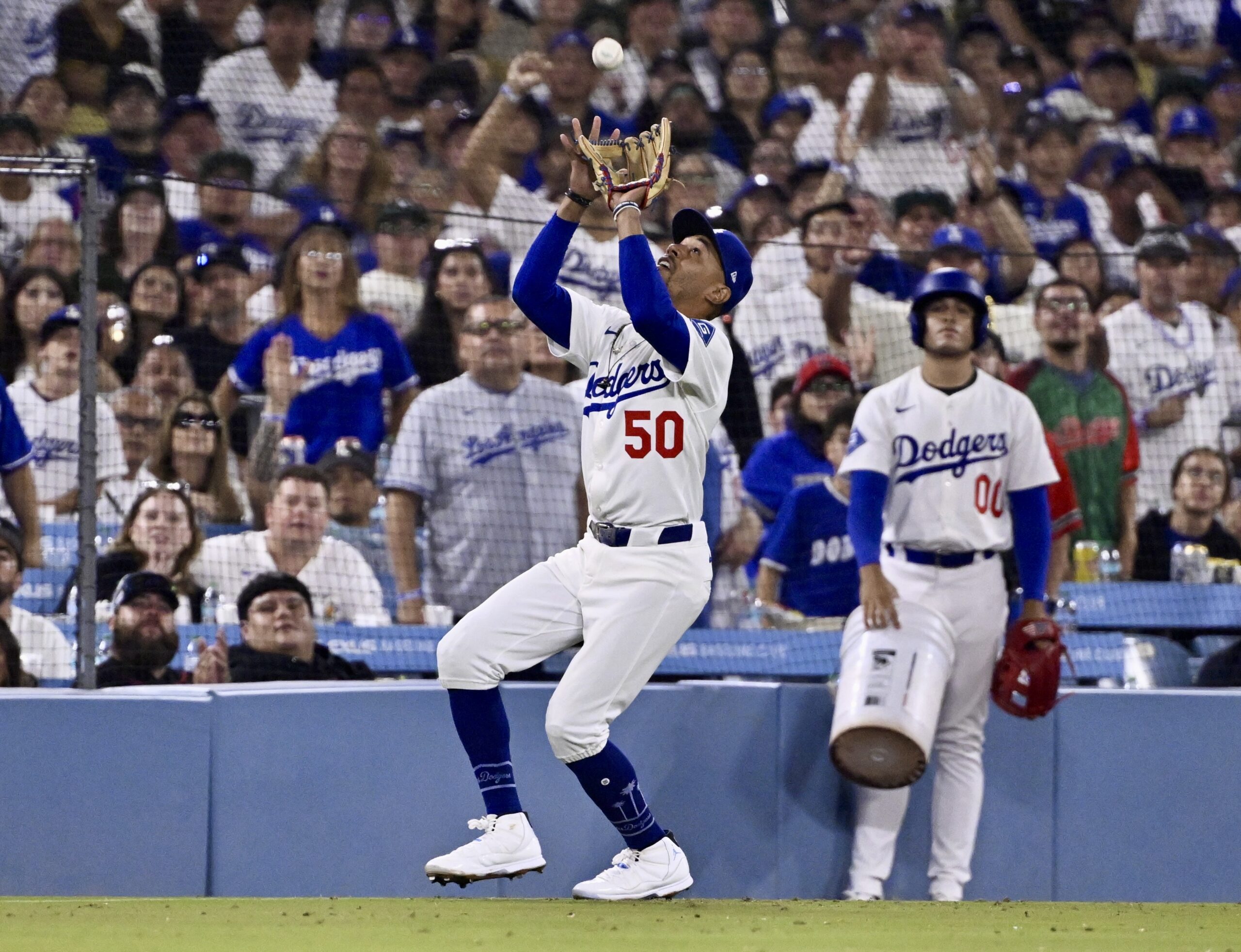 Dodgers shortstop Mookie Betts catches a pop-up hit by San...