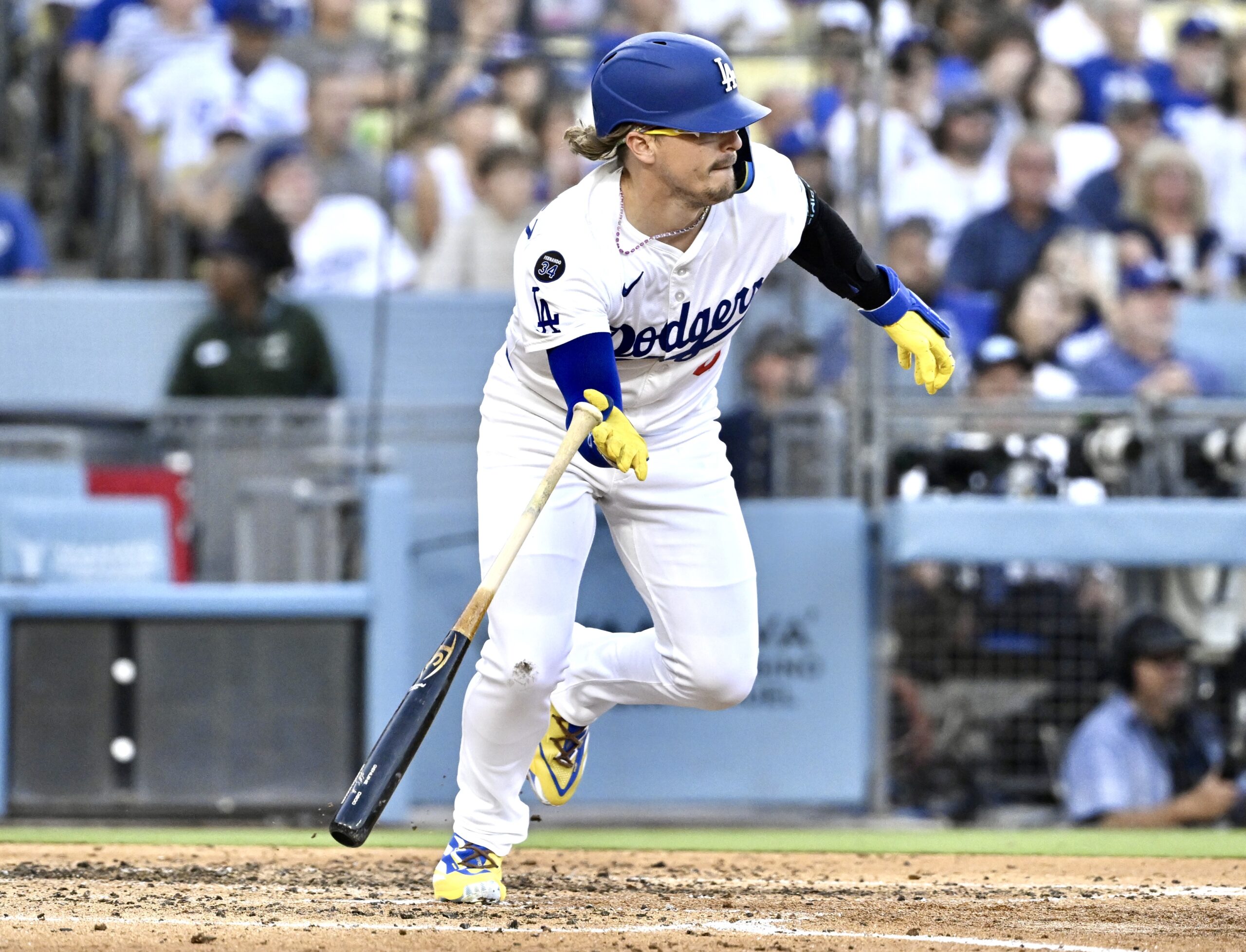 The Dodgers’ Kike Hernandez begins to run after hitting a...