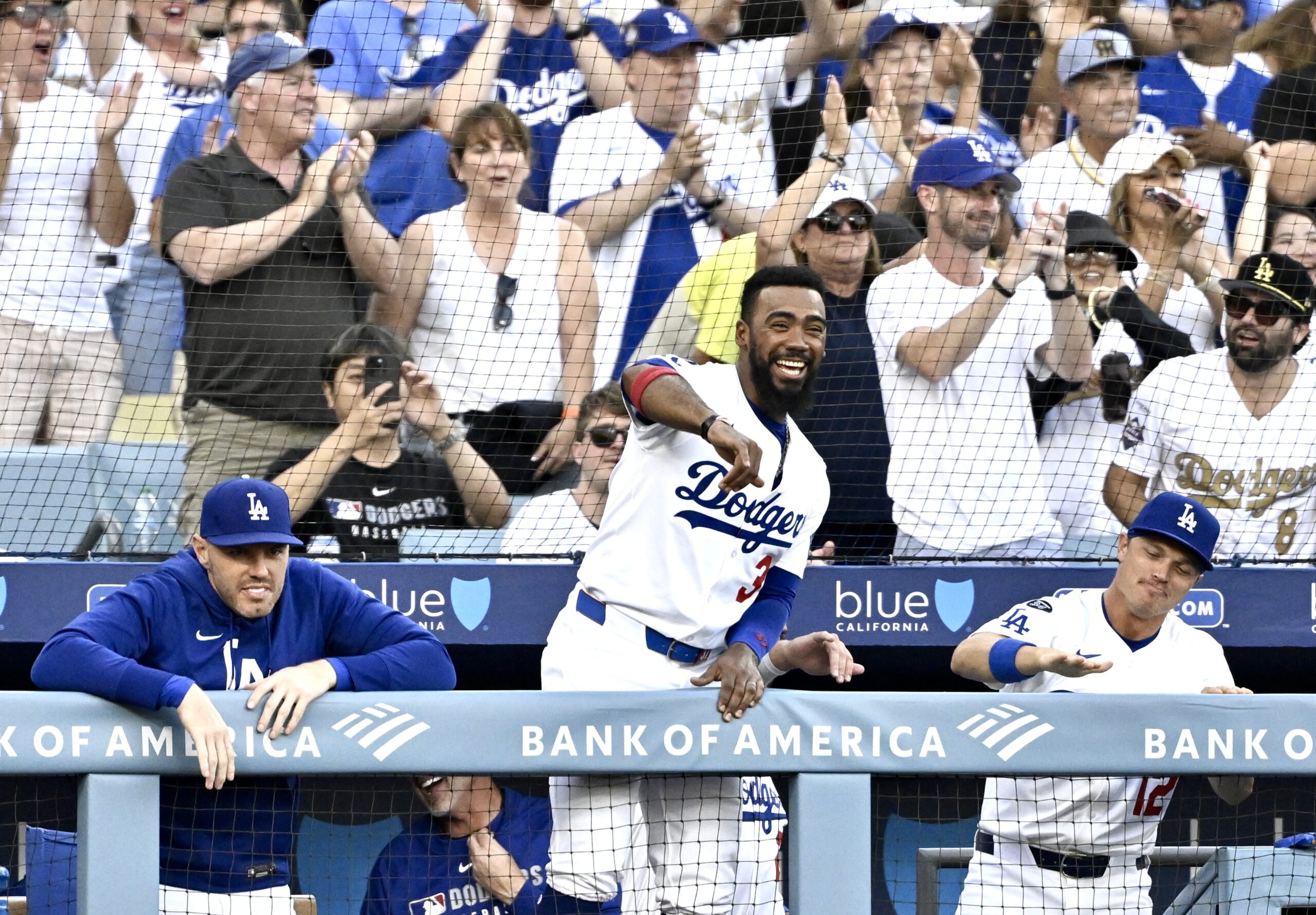 The Dodgers’ Teoscar Hernández, center, reacts after teammate Dalton Rushing...