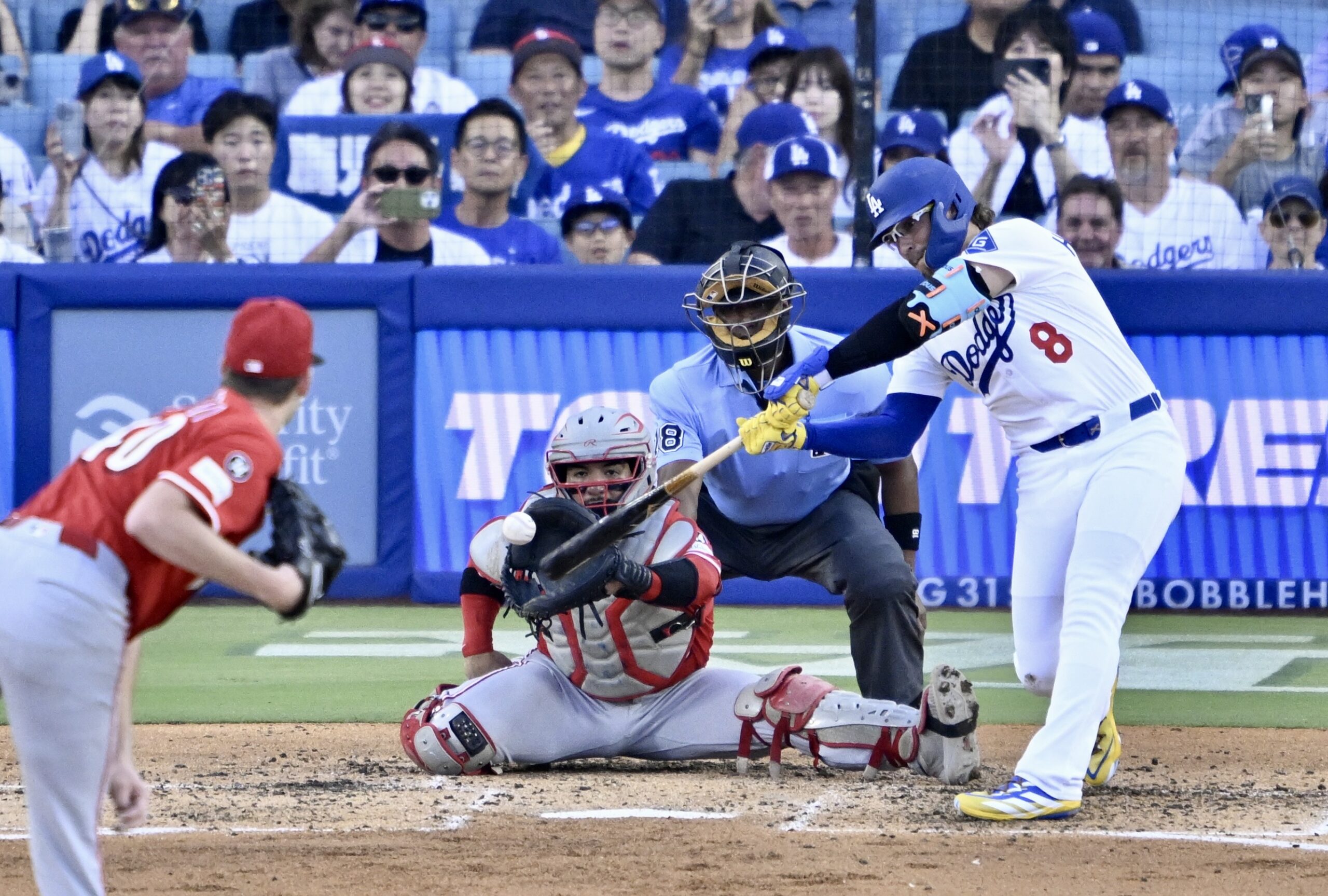 The Dodgers’ Kike Hernandez hits a two-run single during the...