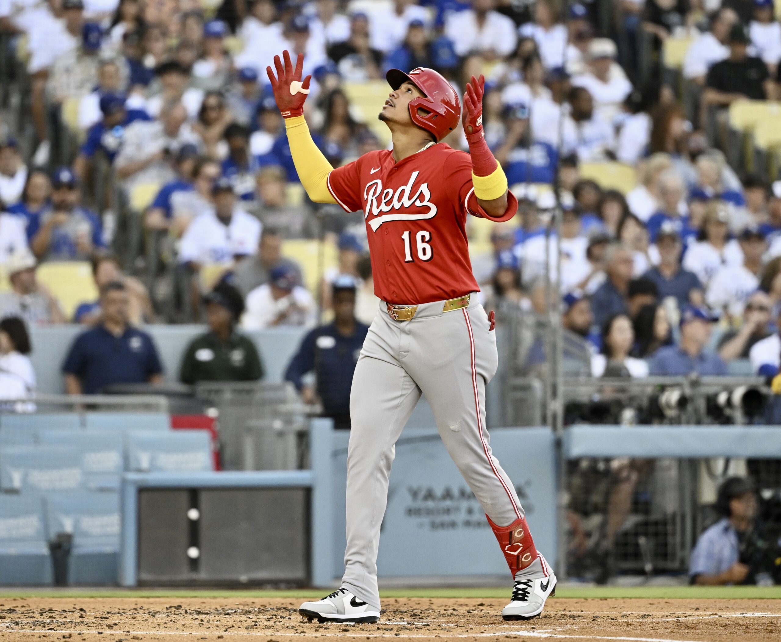 The Cincinnati Reds’ Noelvi Marte gestures as he crosses home...