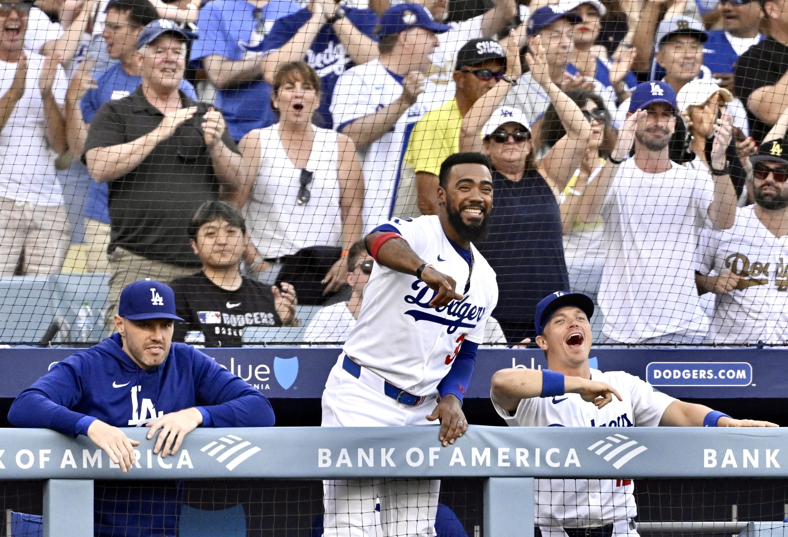 The Dodgers’ Teoscar Hernández, center, reacts after teammate Dalton Rushing...