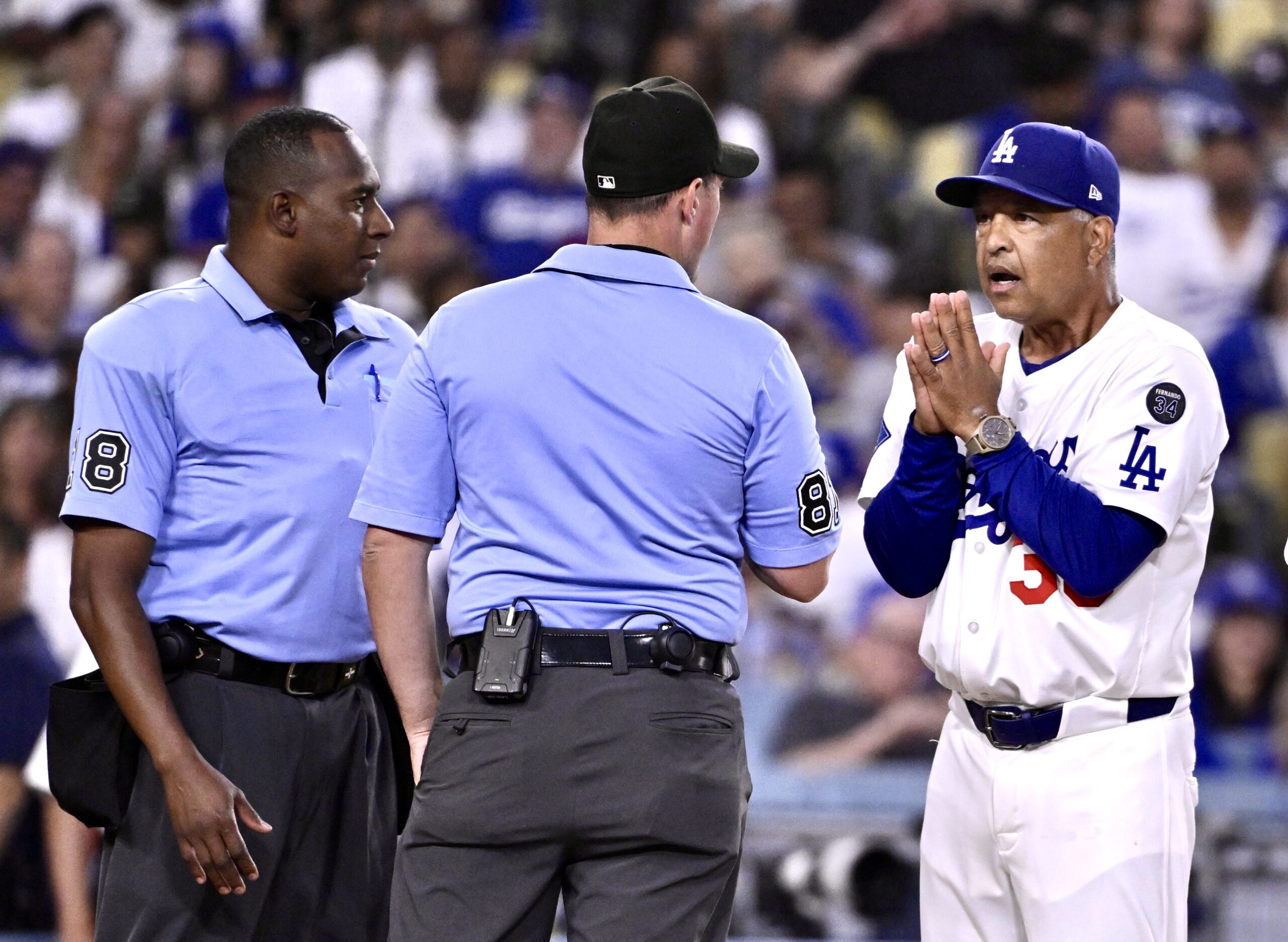 Dodgers manager Dave Roberts pleads with the umpires after Miguel...