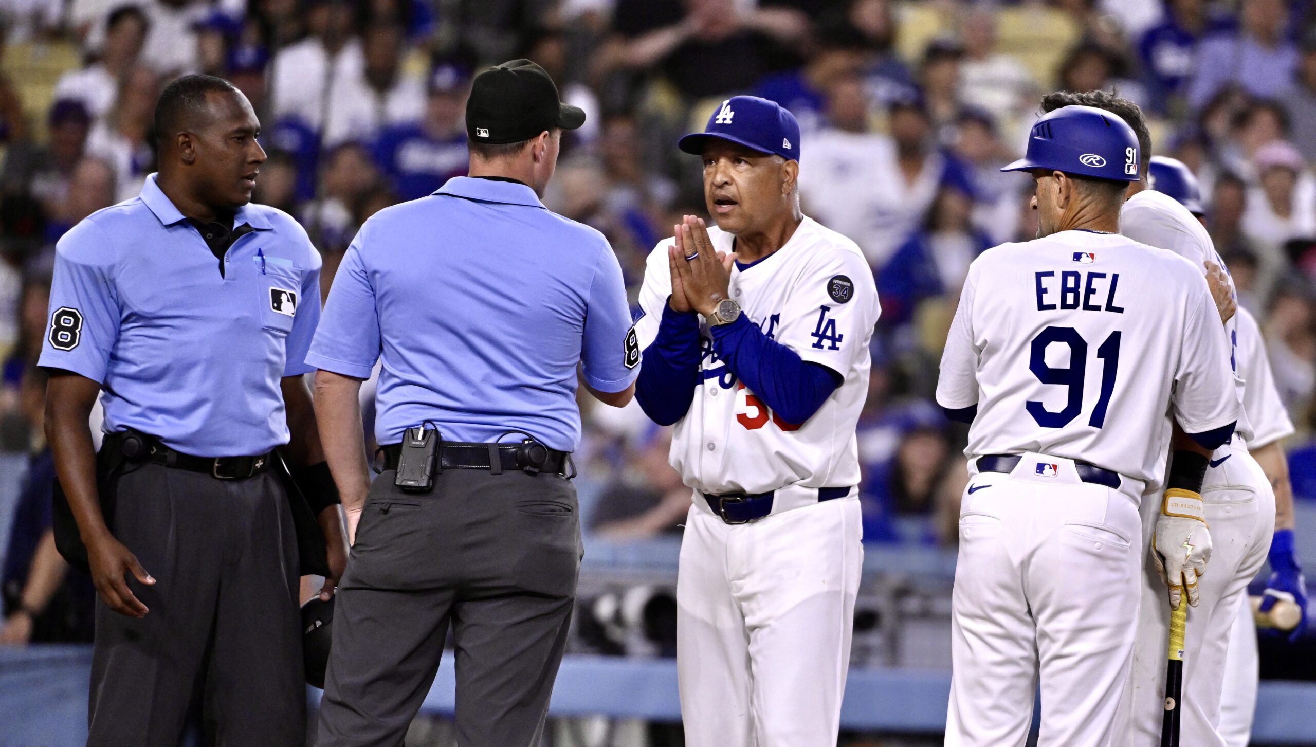 Dodgers manager Dave Roberts pleads with the umpires after Miguel...