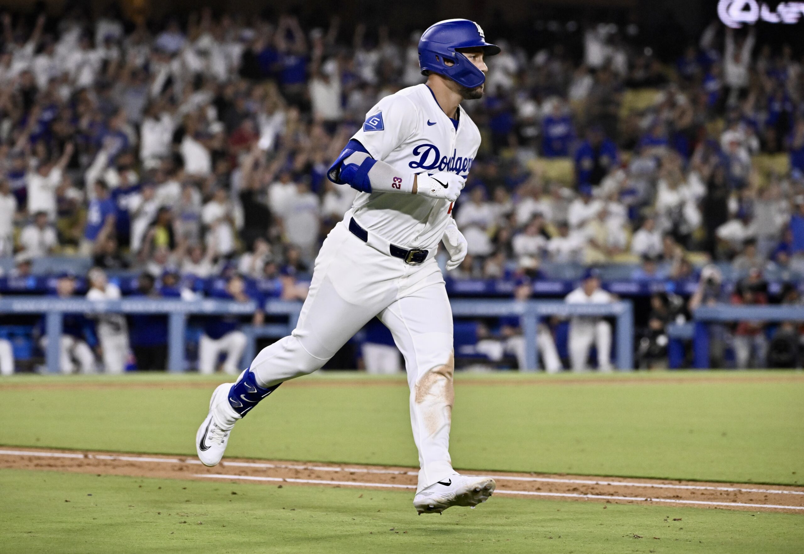 The Dodgers’ Michael Conforto watches the flight of his solo...