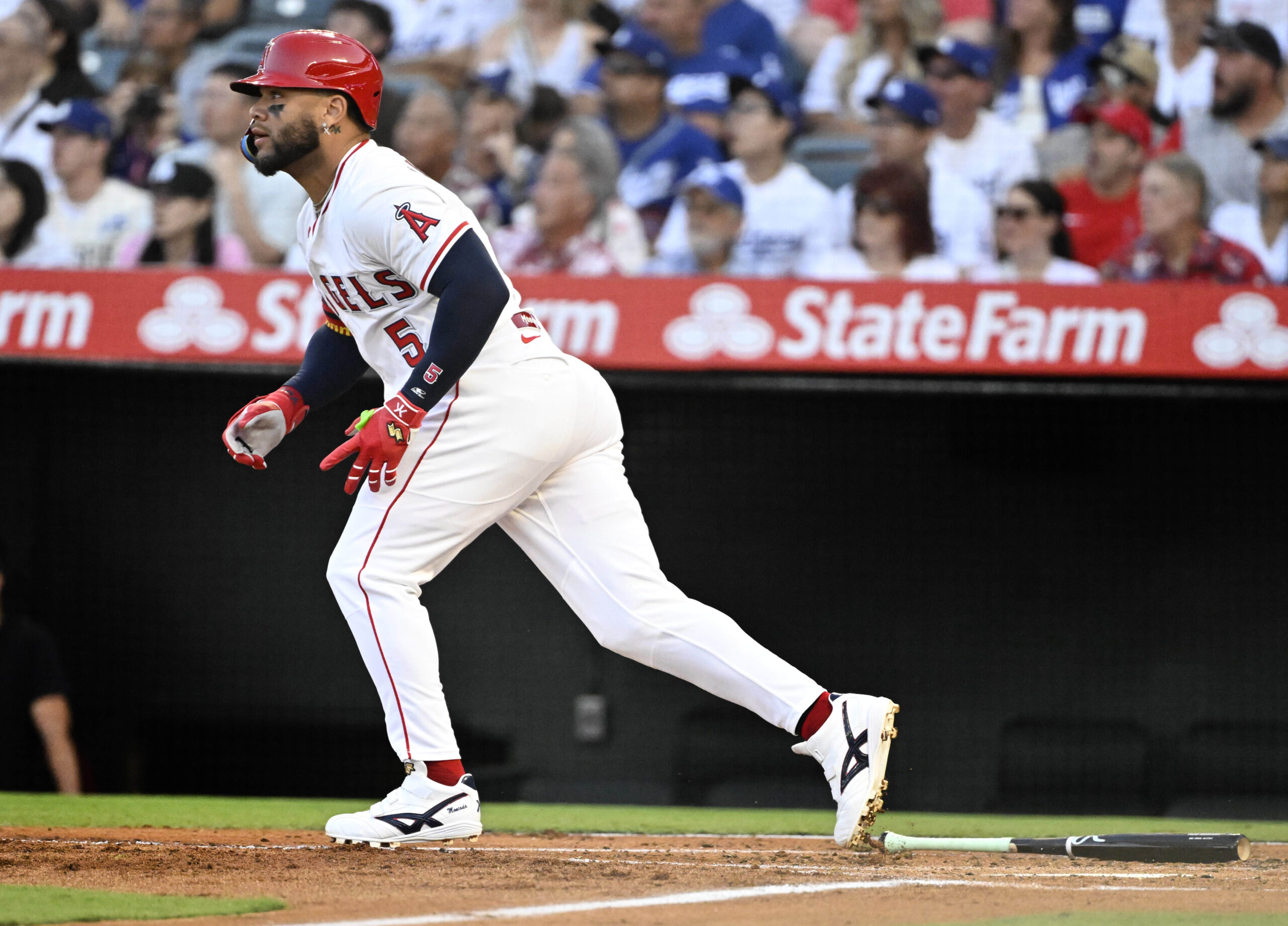 The Angels’ Yoán Moncada begins to run as he watches...