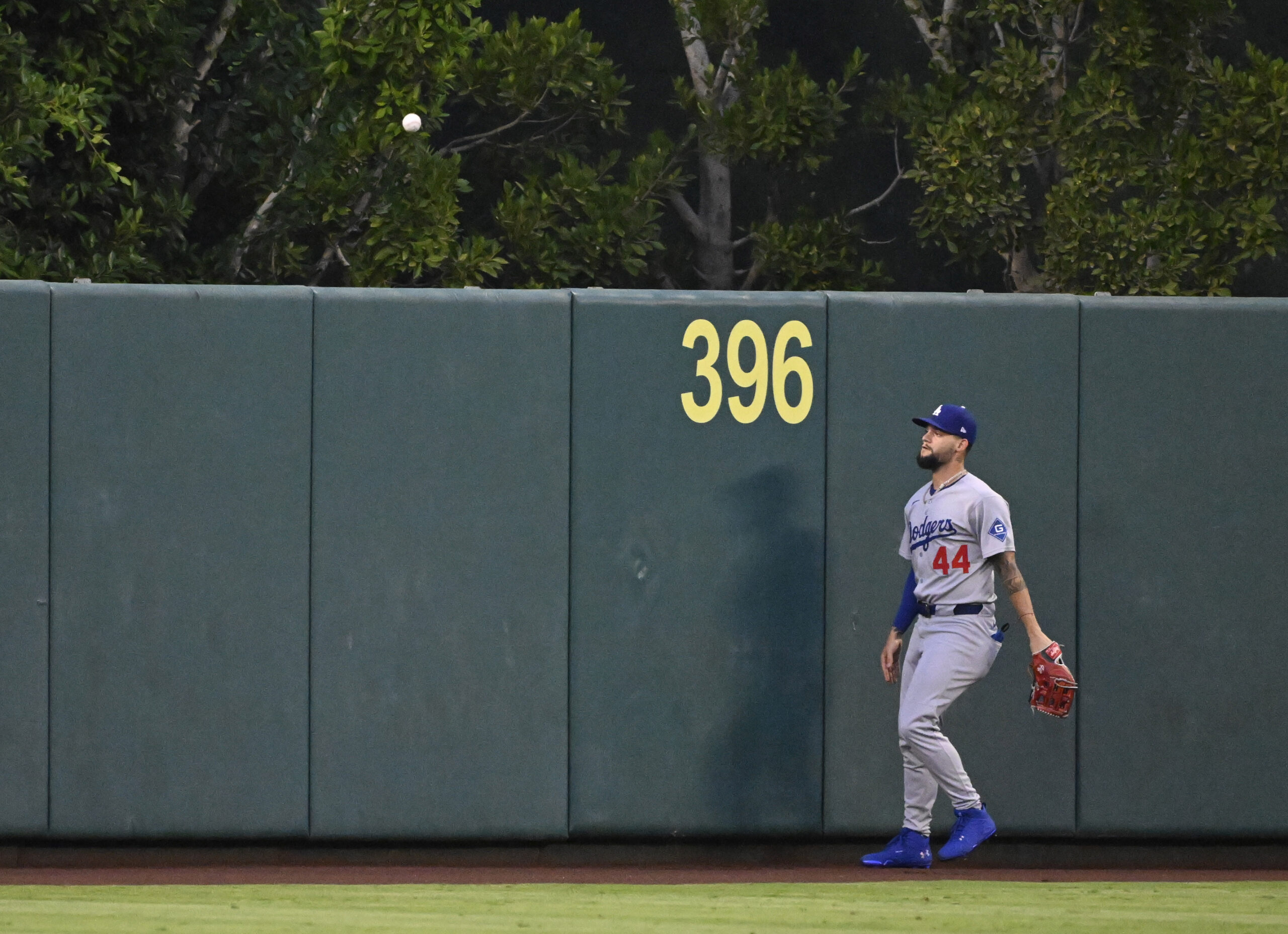 Dodgers center fielder Andy Pages watches as a ball hit...