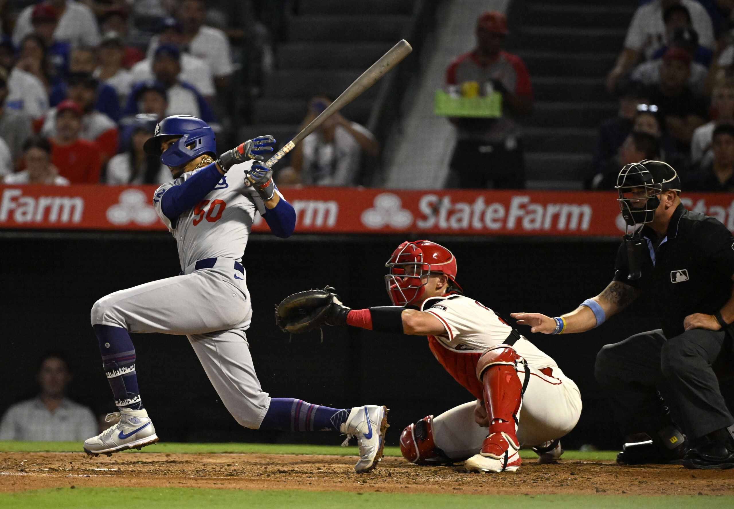 The Dodgers’ Mookie Betts hits a single during the fifth...