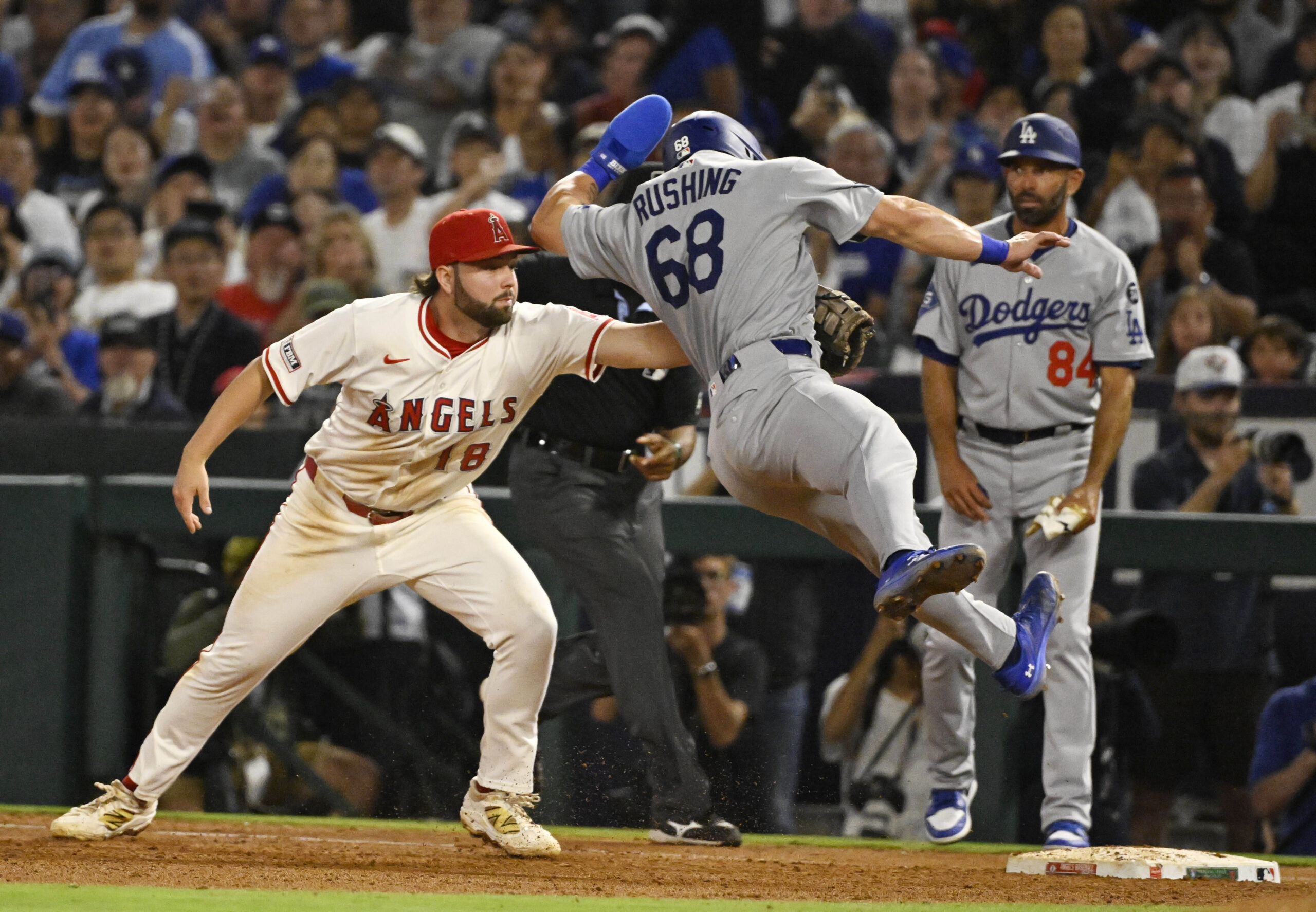 Angels first baseman Nolan Schanuel, left, tags the Dodgers’ Dalton...