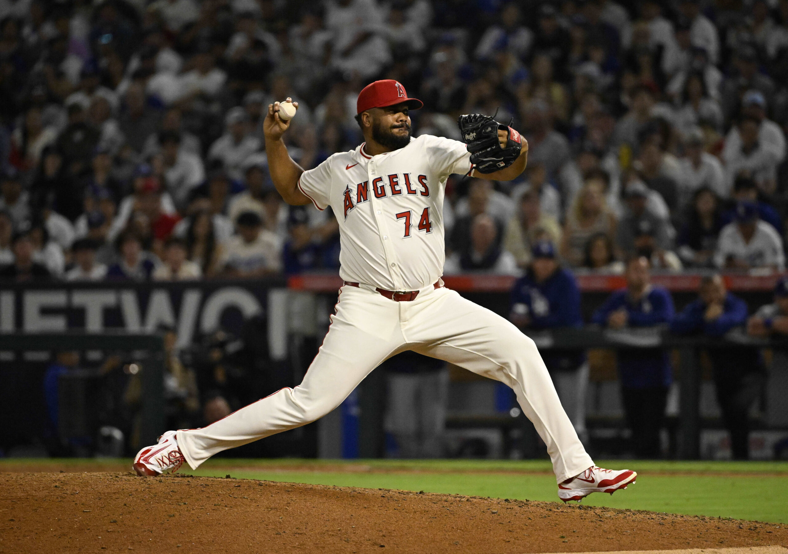 Angels relief pitcher Kenley Jansen throws to the plate during...