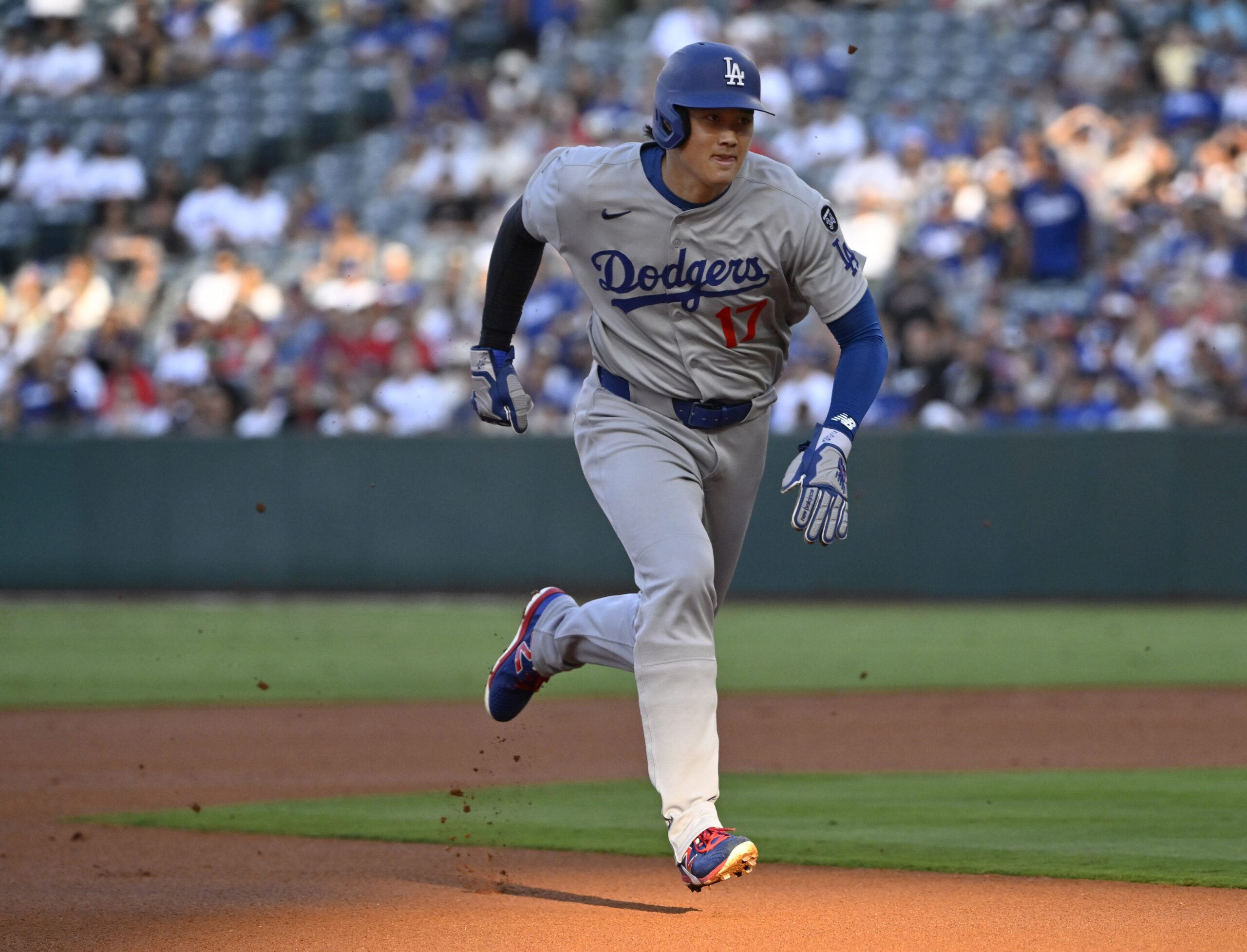 Dodgers star Shohei Ohtani advances to third base on a...