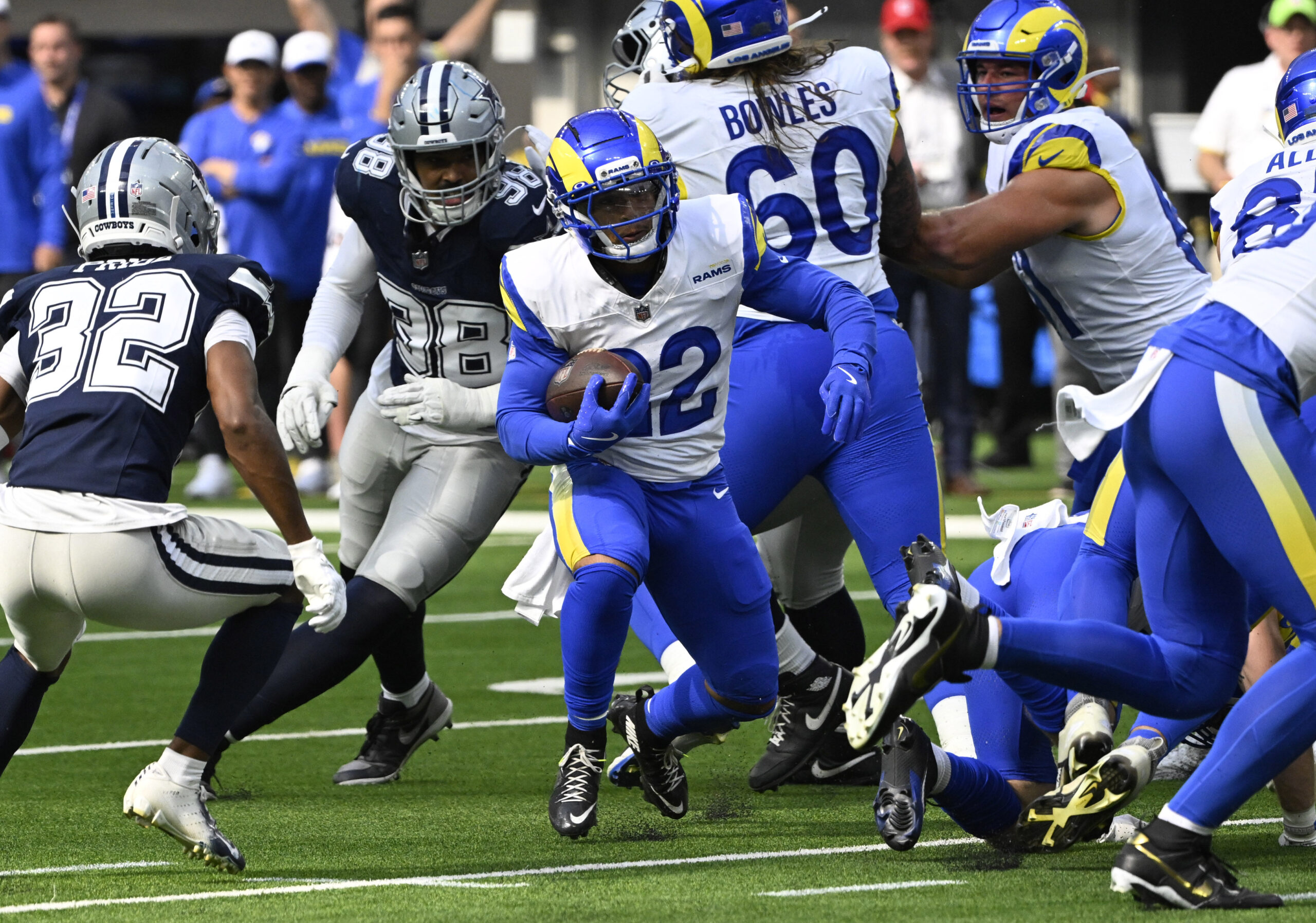 Running back Blake Corum #22 of the Rams runs for...