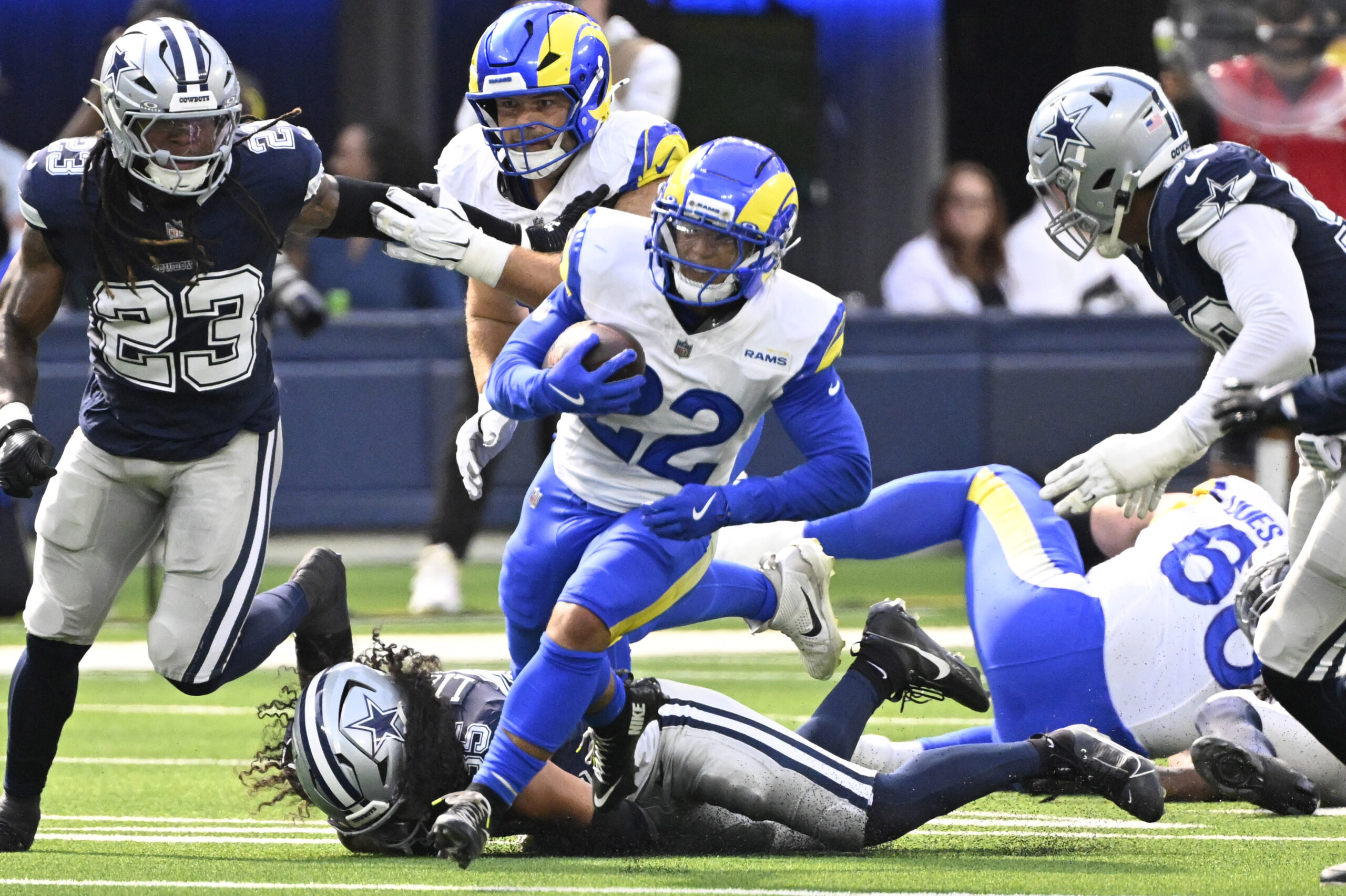Running back Blake Corum #22 of the Rams runs for...