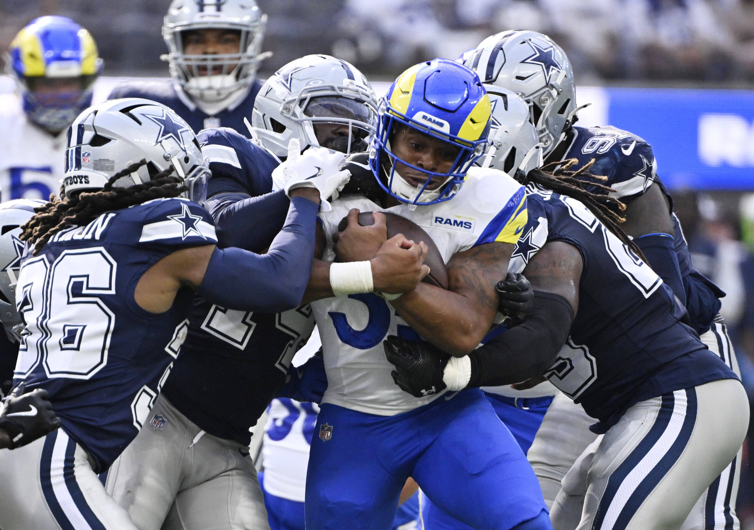 Running back Jarquez Hunter #35 of the Rams runs for...