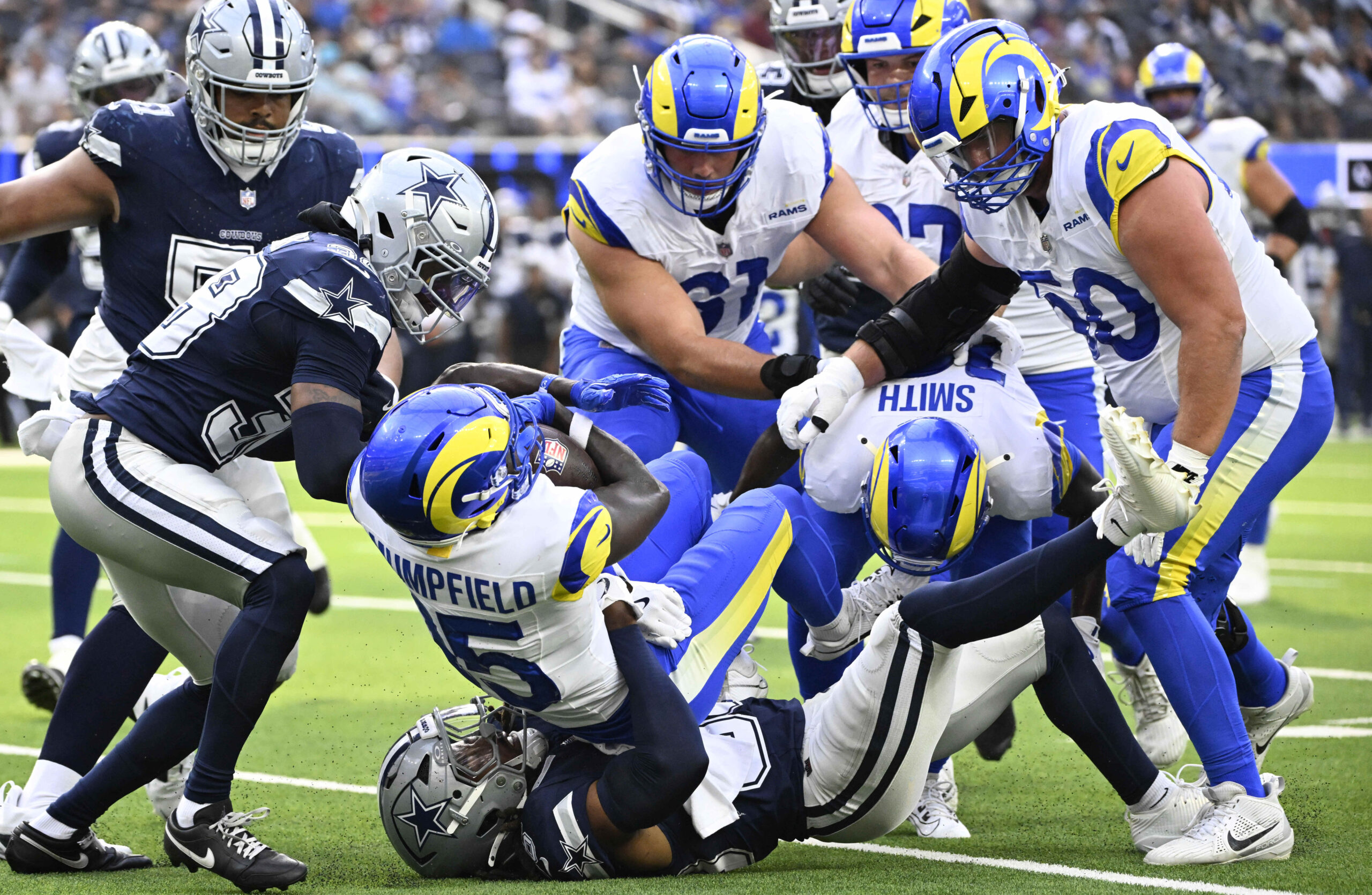 Wide receiver Konata Mumpfield #15 of Rams runs for a...
