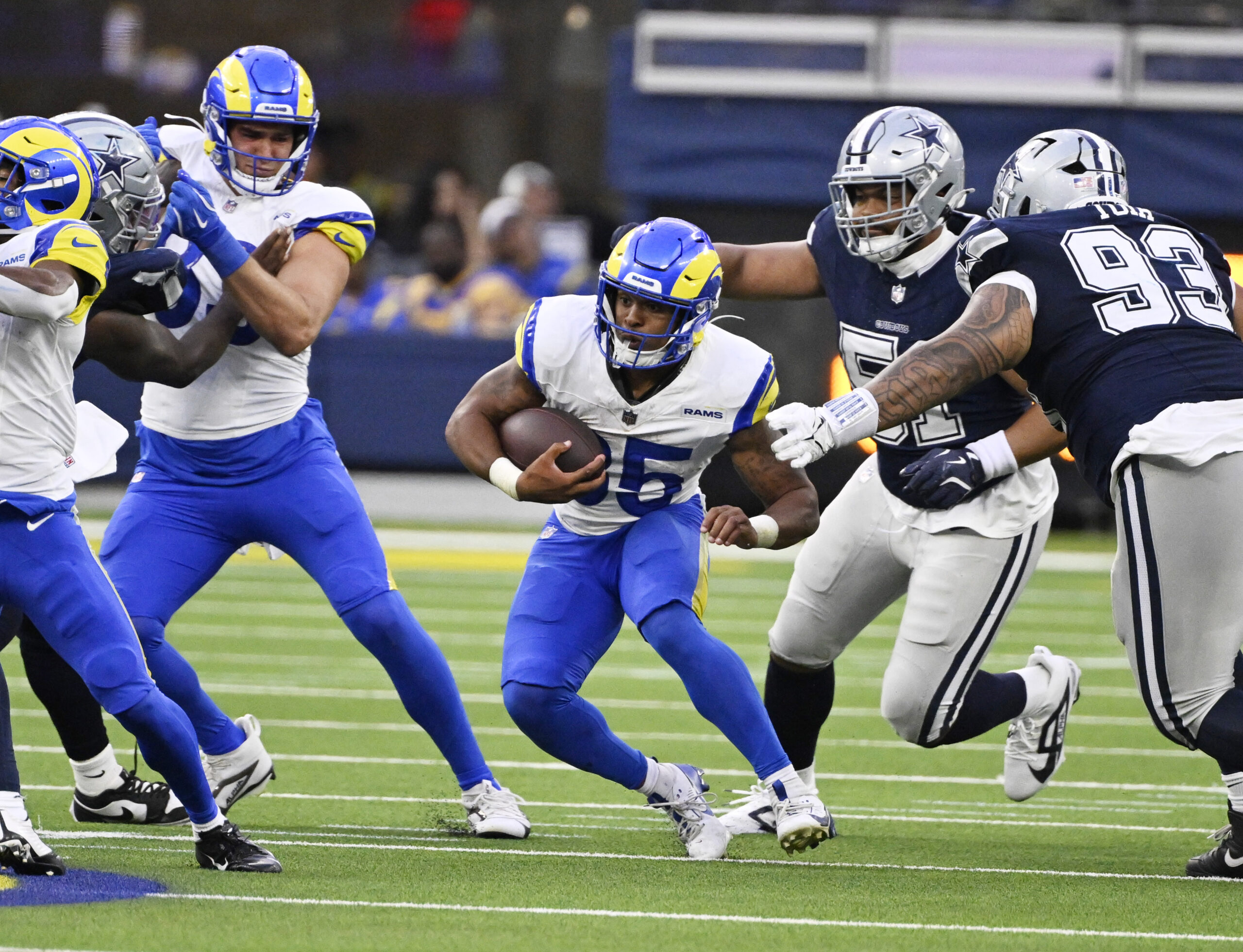 Running back Jarquez Hunter #35 of the Rams runs for...