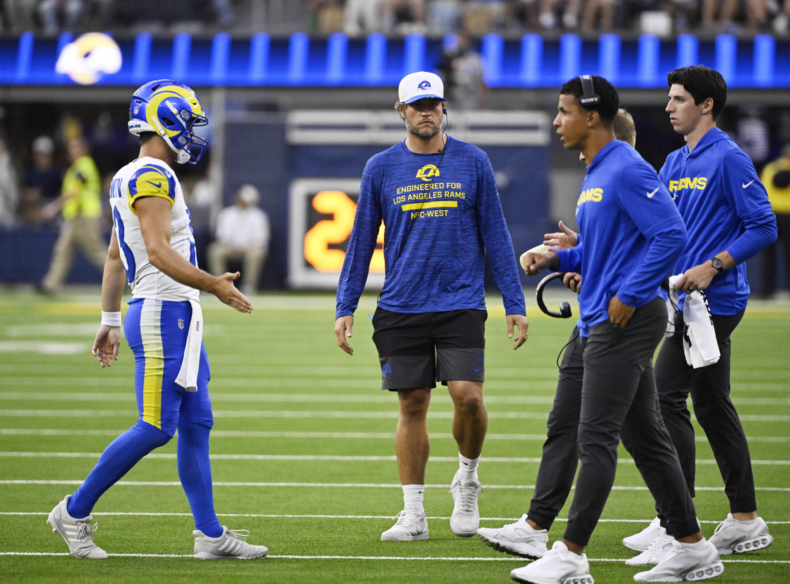 Quarterback Matthew Stafford, center, with quarterback Stetson Bennett IV #13...