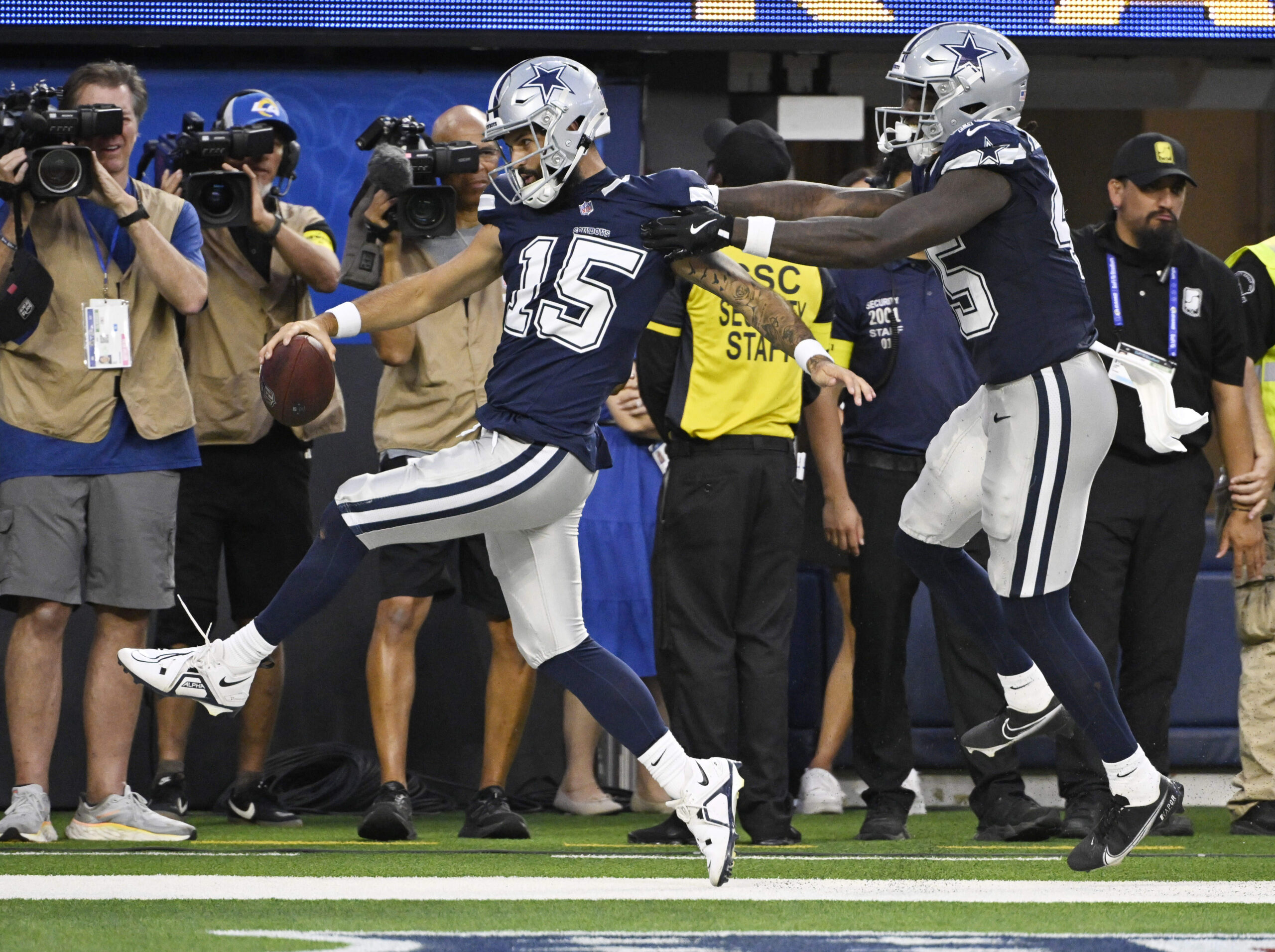 Quarterback Will Grier #15 of the Dallas Cowboys runs f...