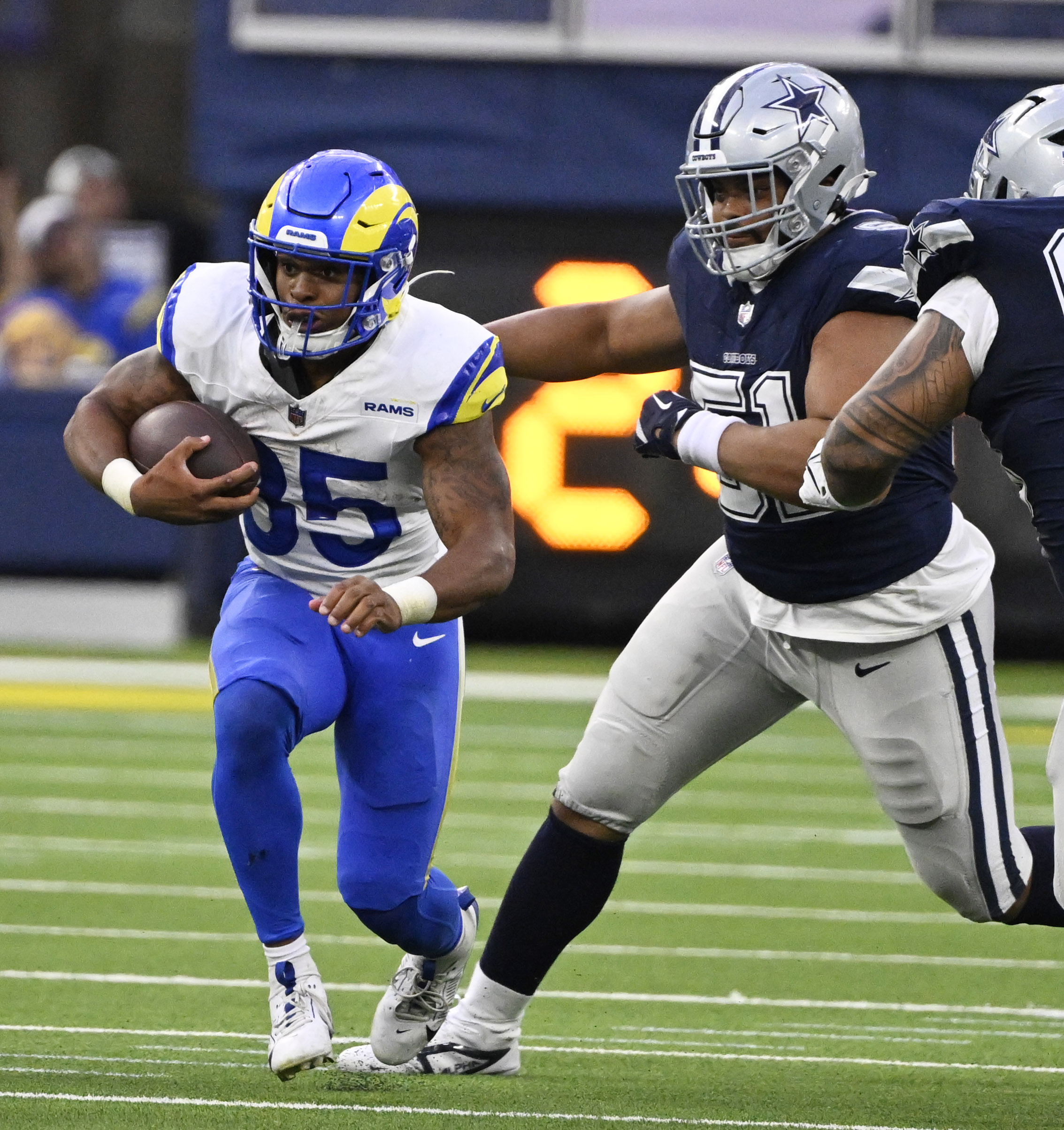 Running back Jarquez Hunter #35 of the Rams runs for...